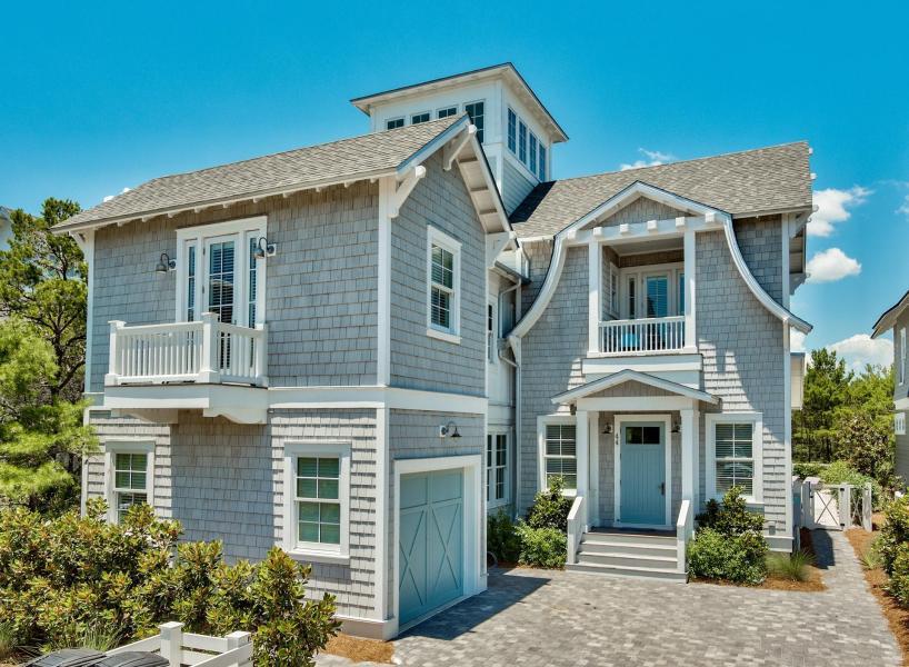 This exquisite home is a Watersound spectacular located just steps from the beach! Amenities include private heated pool backing up to Puttering Park, outdoor shower leading to master suite. Floor plan features 5 BR suites with 5 full & 2 half BA, large open light and bright kitchen with high end Viking Stainless Steel appliances. Circular staircase leads to 3rd floor viewing tower with Gulf views. White washed oak floors throughout, coquina shell fireplace and accents. Sold fully furnished with tasteful decor. 
Designed and furnished by 'Classical' design firm in Atlanta. Extra Large Kitchen and Den perfect for large family gatherings with a warming tabby fireplace and wrapped in white wood from top to bottom. Hand wired crystal lighting from Turkey, Custom designed over sized memory foam couch and chairs. Bedrooms feature individual pieces of either shutters from the south of France or grand gates of Tibet. Five full beautifully appointed baths and beautiful French mirrors and Restoration and Pottery Barn pieces throughout the home. Another intimate upstairs den that can sleep two and leads to the 3rd story viewing tower with 16 casement windows to enjoy the sea breeze and views and a wonderful hanging bean bok bed from Europe. The Chefs Kitchen features Viking appliances, ice maker, double wine cooler, aqua marine quartz counter tops, custom cabinets and tabby finish arch. The outdoor features include a heated salt water pool, screened porch with bricked gas starter fireplace and TV, summer kitchen and a green egg. four additional porches with access from individual bedrooms featuring swings and Adirondack seating overlooking the puttering park and more. Additional features include plantation shutters, Sonos sound system with speakers throughout the home, Ipe wood decking, recessed lighting, alarm system and more.