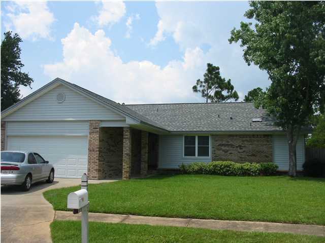 This one will not last long!!!! About a 15 minute drive to Hurlburt Field. Beautiful and very well maintained 3 bedroom, 2 bath home on a quiet cul-de-sac. Kitchen includes stainless steel refrigerator, oven/cook-top, dishwasher, built-in microwave and garbage disposal. Open floor plan as kitchen overlooks both the dining room and the living room. Breakfast bar with recessed lighting. Lots of kitchen cabinets. Living room has functional wood fire place. Very nice sized master bedroom with walk-in closet and separate double sink vanity area. Separate laundry between the kitchen and two-car garage. Very nice light fixtures and ceiling fans throughout the house. Sliding glass door off living room leads to a large cement patio and fenced back yard that backs up to woodlands. has underground utilities and sidewalks. Pets authorized with owner approval and a $250 non-refundable pet fee. Smoking is not authorized inside rental. Sq footage is per tax record.