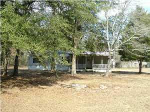 One acre lot cleared, fully fenced in a convenient country location. This is a 2/1 mobile home that has been freshly painted and in very nice shape. Rent includes a refrigerator, stove. No dishwasher or w/d. There is a storage building/garage for renters use. Will consider pets with prior approval. No smoking inside this home. Credit and Background check will be performed. Application fee $50. Property will be ready to rent 5/1/2018 or before. Current tenant still in the house. Please do not enter property. Shown by appointment only.