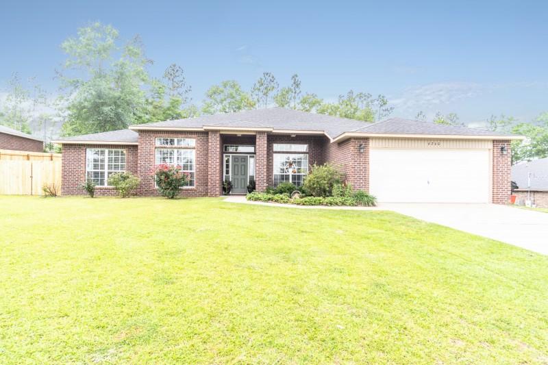 Move-in ready! Beautiful, well maintained, 4 bedroom, 3 bath home, on 2/3 of an acre. This inviting home has 2,630 sq. ft. with an eat in kitchen that has granite countertops, plenty of cabinet space, a pantry, beautiful stone back splash, a custom built in banquette, and an island! The kitchen opens to a formal dining room, a spacious living room and a den to make plenty of room for entertaining. There is ample storage throughout the home, as well as custom closets in two of the bedrooms. The oversize master suite has a sliding door that leads to the back patio, 2 large walk in closets, a trey ceiling, double vanities in the bathroom, a large tub, and a separate shower. There is tile and wood laminate flooring throughout the home.  The living room has sliding glass doors that lead to a covered back porch and a large yard that is perfect for family gatherings.  The fire pit is ready to go and the fenced in yard has plenty of space for kids or dogs to play!
