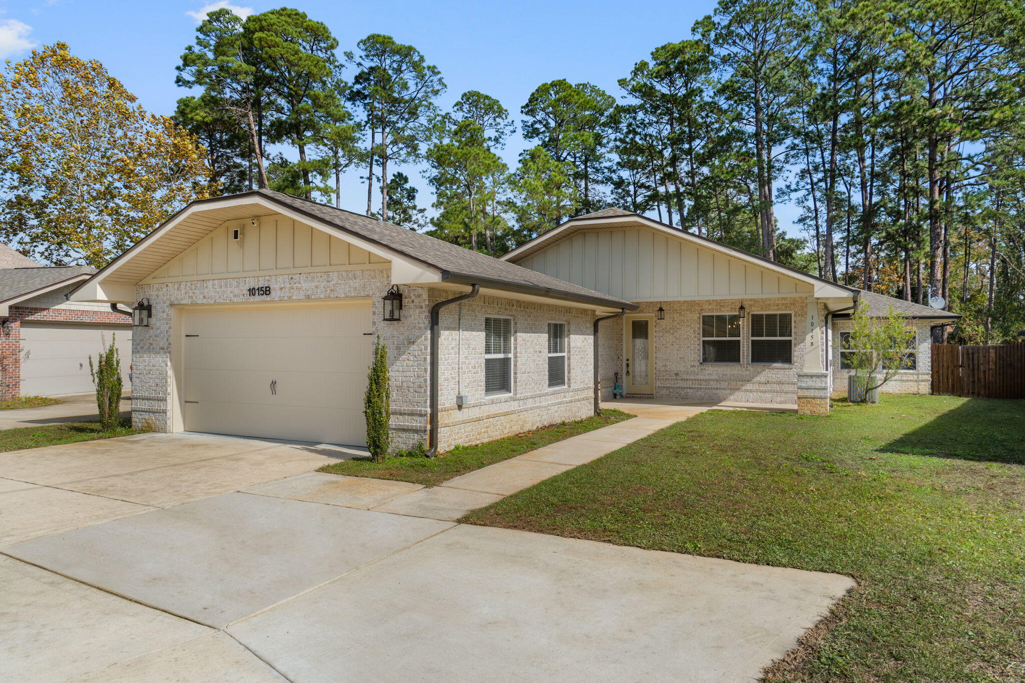 Bring your boat or RV! Welcome home to this stunning custom brick residence built by a Parade of Homes award-winning builder. Ideally located with no HOA, you'll be just 6 minutes from Hurlburt Field's back gate and 10 minutes from Eglin AFB, making this the perfect blend of convenience and comfort.

From the oversized driveway with RV pad (and 50 AMP RV hookup!) to the massive screened-in porch overlooking the large fenced backyard, this home is designed for both functionality and relaxation. Step inside to soaring 10 ft. ceilings, elegant crown molding, 8 ft. interior and exterior doors, custom-milled casings, and durable wood-look tile flooring throughout - a true showcase of quality craftsmanship.

Beyond the inviting covered front porch and beautiful glass entry door,  you'll find a thoughtful and spacious 2,540 sq. ft. floor plan. The split layout offers exceptional privacy: two guest bedrooms share a Jack-and-Jill style bath with double vanities, while a fourth bedroom sits on its own wing with a private full bathroom which could be ideal for guests or occupants who would appreciate a little more privacy - or a quiet home office.

The owner's suite is a peaceful retreat featuring abundant natural light, crown molding, and two custom walk-in closets with wood shelving. The en suite bathroom includes two separate vanities, a walk-in shower, a relaxing jetted tub, a private water closet, and a convenient linen closet.

The chef's kitchen is sure to impress with granite countertops, a prep sink, undermount lighting, a stylish backsplash, stainless steel appliances, and a built-in wine fridge. Don't miss the show-stopping oversized refrigerator and freezer - a true standout feature! And enjoy the convenience of TWO pantries complete with custom wood shelving.

Located just minutes from the Emerald Coast's sugar-white beaches on Okaloosa Island, this home offers the best of Florida living. Move-in ready, beautifully finished, and loaded with upgrades this one checks every box.