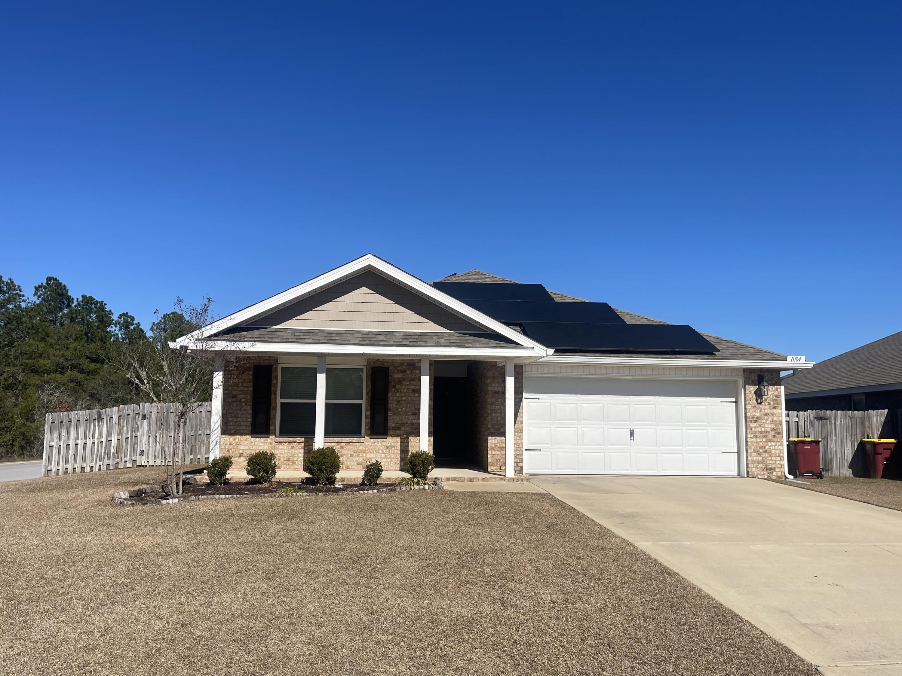 Located in the desirable Redstone Commons, this one-story home features four bedrooms, two bathrooms, a covered back porch,  a two-car garage, water softener, and solar panels for lower power bills.   
Upon entering, you will notice the interior has been newly painted. The open kitchen includes a center island, stainless steel appliances, granite countertops, and a spacious pantry. The kitchen opens to a great room with access to the covered porch and a concrete pad extending the full length of the house, perfect for entertaining family and friends.
The large owner's suite is situated at the back of the home, and the attached bath features a walk-in closet and dual sinks.