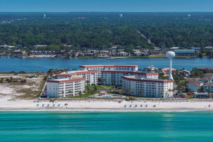THIS IS THE DESIRED TOP 6TH FLOOR CONDO IN #5 BUILDING.   Expansive 11+ acre condominium resort sits between the sugar white beaches and emerald, green waters of the Gulf of Mexico and the Santa Rosa Sound. This gated community is located at the west end of Okaloosa Island with protected beach to the west. This 2-bedroom is an amazing investment property, vacation home, or primary residence and comes fully furnished and rental ready. SELLER TO REPAIR CRACKED TILE ON BALCONEY.