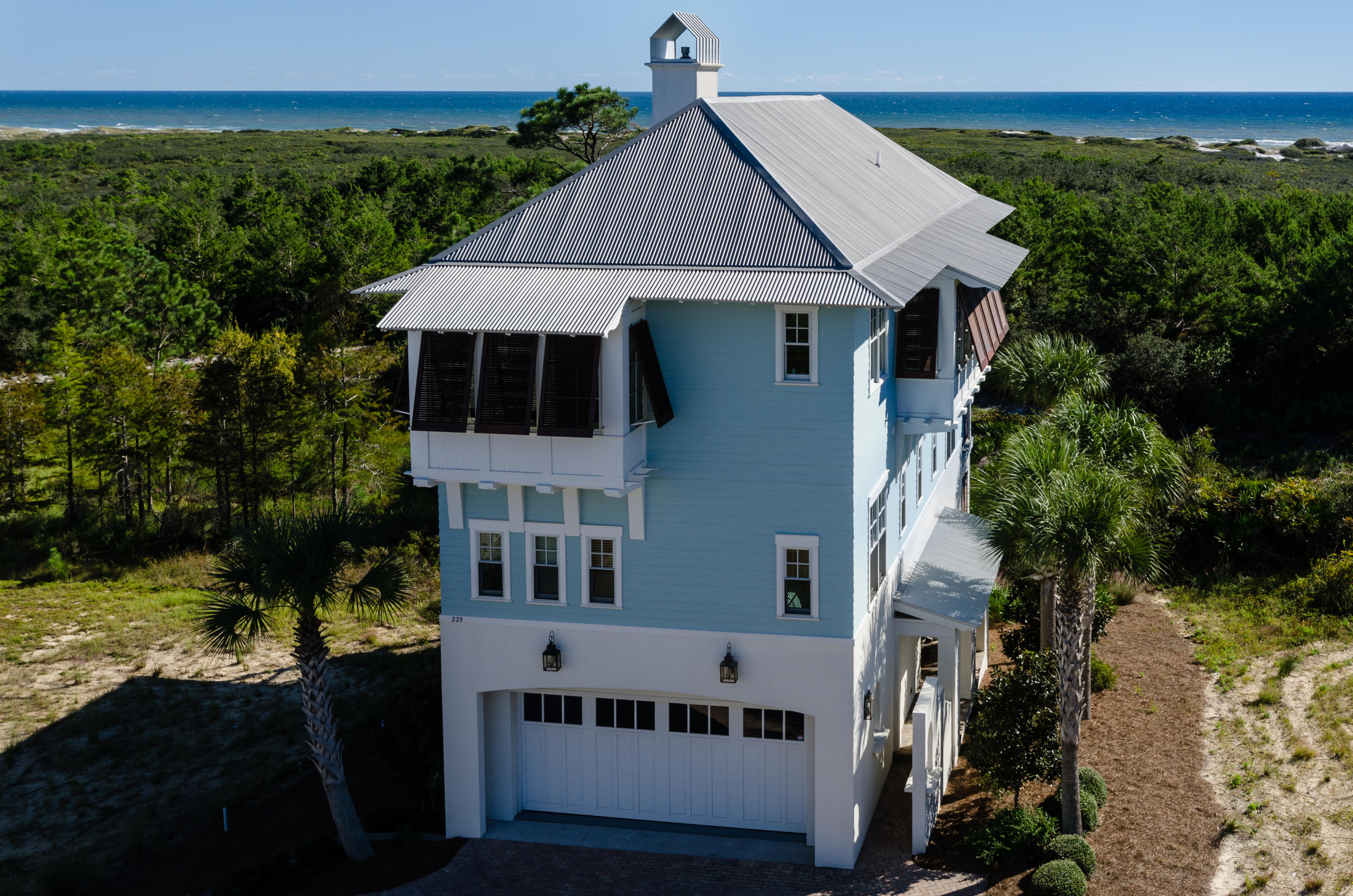 Luxury GULF FRONT home built by John Willis in the gated community of Cypress Dunes. South of 30A, overlooking Topsail State Park & the Gulf of Mexico. Designer features include 3 story elevator, wide-oak plank hardwoods, honed granite counters, mahogany shutters, wood paneled walls & 2 car garage. Top floor expertly planned with open living arrangement. Kitchen, dining & living with panoramic views in mind. Kitchen loaded with wine cooler & ice machine, plus an extra breakfast/sitting area. Comfort in all 4 bedrooms. 1st floor equipped with built-in double sized bunks. 2nd floor boasts Master Suite & balcony plus 2 bedroom suites with private bathrooms. Balconies deliver a slice of gulf-front tranquility. In addition, neighborhood cypress preserve & boardwalk is just out your front door. One of the most beautiful settings on 30A, Cypress Dunes clubhouse offers a stunning infinity-edge pool that overlooks the Gulf of Mexico & Topsail Hill State Preserve. Of the highest design, the complex is climate controlled, offering a full exercise center, artful patios & gathering places, plus an outdoor fireplace. Also, enjoy 2 tennis courts.