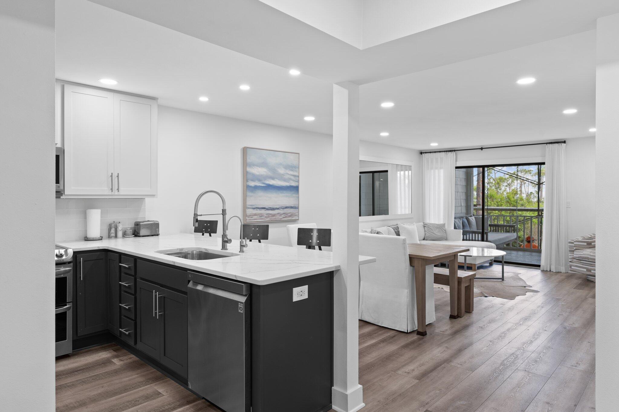 Step into a world of boundless inspiration at 8980 Heron Walk Drive, a breathtaking 2-bedroom, 2-bathroom bay-front condo, exquisitely renovated inside and out, where coastal elegance meets modern luxury in the heart of the prestigious Sandestin Golf and Beach Resort. 

Whether you envision a lucrative rental investment or a life where every day feels like a vacation, this home welcomes you with a wave of serenity, carried by a radiant, open-concept floor plan drenched in natural light. The seamless flow of the kitchen, dining, and living spaces opens to a covered lanai, where awe-inspiring views and vibrant seasonal sunsets invite you to pause and dream.

Every detail radiates sophistication, from the sleek luxury plank flooring to the contemporary lighting and tranquil coastal hues that envelop the space in warmth and elegance.

The fully reimagined kitchen, a true masterpiece, sparkles with gleaming quartz countertops, premium stainless steel appliances, and bespoke cabinetry offering abundant storage and counter spacedesigned to ignite culinary creativity and foster unforgettable gatherings. Discover the cleverly concealed laundry appliances, a thoughtful touch that enhances both form and function.

Experience a symphony of elevated enhancements crafted to enrich your lifestyle, including a screened-in lanai for serene evenings, a chic wine bar with a dedicated refrigerator, whisper-quiet ceiling fans, soft-close cabinet hinges, and an advanced water filtration system. This state-of-the-art technology purifies water while preserving essential minerals, delivering a crisp, naturally balanced taste that elevates every sip.

Retreat to the generously appointed bedrooms, where the primary suite becomes your personal sanctuary, framed by mesmerizing water views, blackout curtains for restful slumber, a spacious closet, elevated bath fixtures, and a luxurious walk-in shower that redefines relaxation.

The equally refined second bedroom and guest bath offer a warm embrace for family or guests, with elegant plantation shutters and direct bath access ensuring comfort and privacy.

Beyond its elevated interior and meticulously improved exterior, this home transforms your lifestyle with a rare designated golf cart parking space and charging station, perfectly suited to the resort's vibrant, golf cart-friendly community. You're just a 1.1 mile golf cart ride from the beach, and can even take your golf cart grocery shopping, to dining and recreation through the community. 

Fully furnished and move-in ready, more than a homeit's a portal to a life of unparalleled luxury, leisure, and cherished moments along the Emerald Coast.

Professional photos are coming soon, but the vision of your extraordinary future begins now. Dare to embrace a life inspiredyour coastal masterpiece awaits!