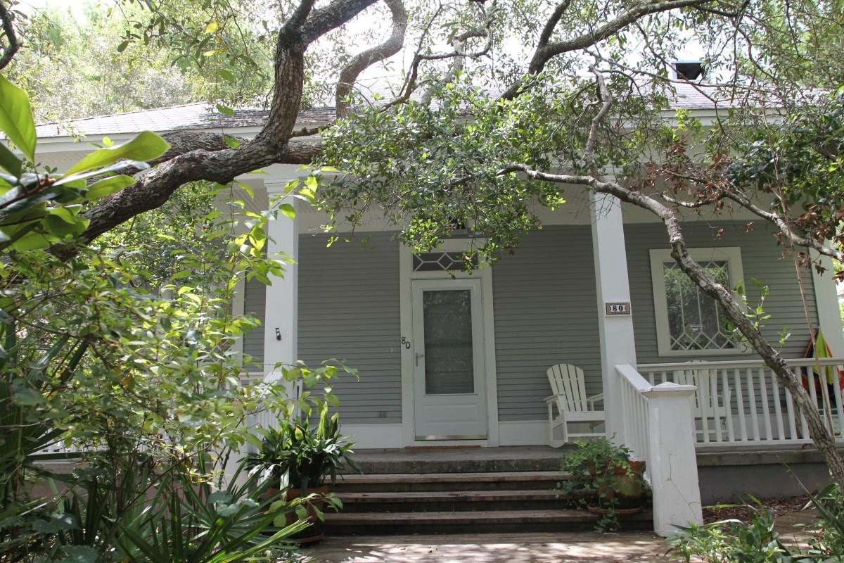 PRICE REDUCED $50,000! Presenting 'Arcadia', a unique custom design/built, classic Grayton Beach cottage. Located on low traffic Magnolia Street only a short stroll to less crowded and undisputed state owned beach, and any of Grayton's many famous restaurants and shops. Renowned architect Ted Dial design features vaulted and raised ceilings, 8'x20' & 8'x32' hallways, built-in shelving, custom columns, detailed door & window tri and a wood burning fireplace. Relax and entertain on front and rear porches, and in the open air central court area that is accessible from inside or out. There is extra exterior storage in rear and owner's lockups inside. 'Arcadia' is handicap accessible, has good, consistent rental history, and is the ideal setting for vacation or permanent living. See more