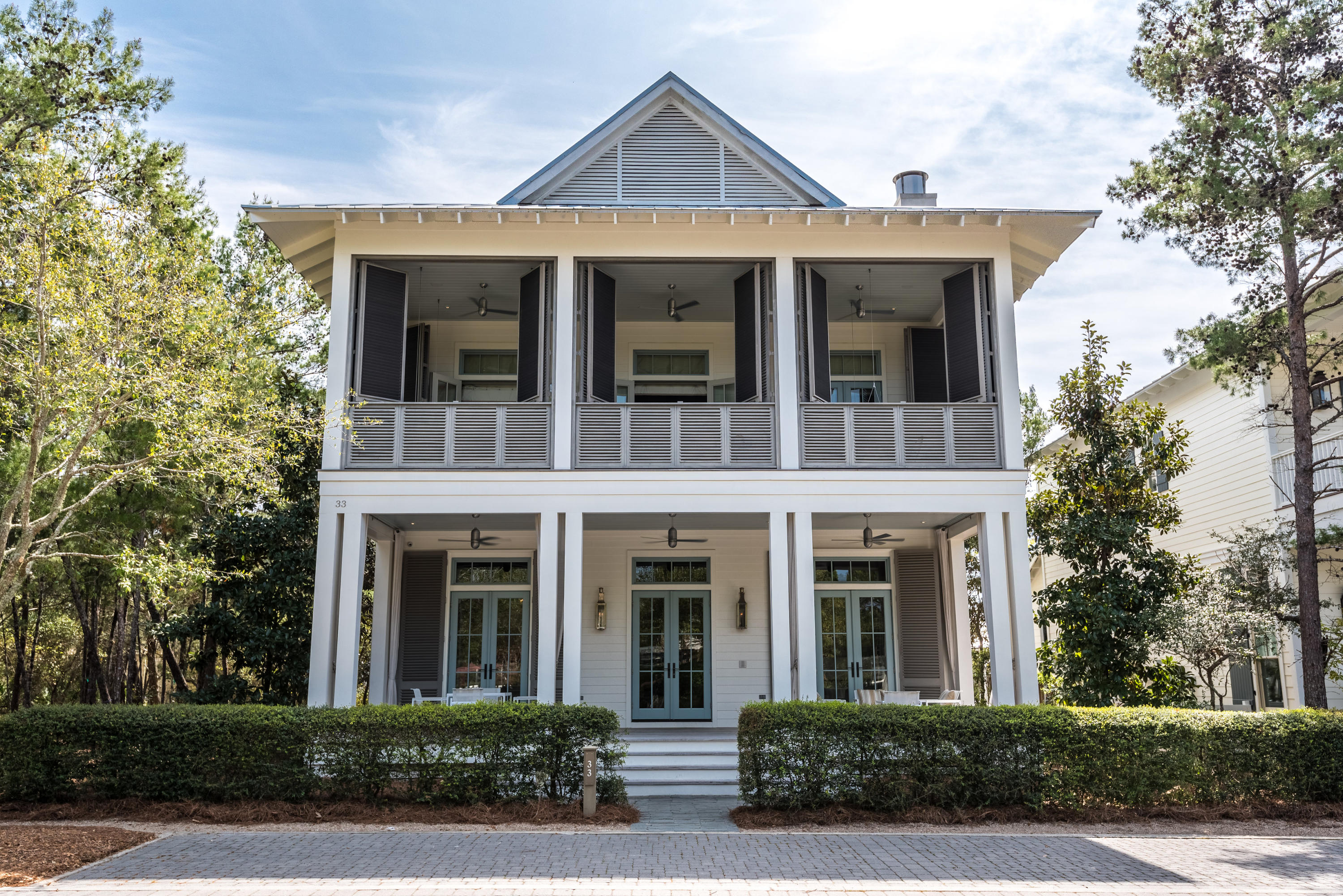 A luxury residence of modern sophistication ideally situated in Watercolor, Florida. Boasting high-end interiors by Phillip Sides, of Montgomery, AL, this home features 100 year-old reclaimed, hand-scraped, wide-plank, white oak flooring, polished Calacatta Gold marble, exposed antique ceiling beams, and pecky cypress doors. The residence is ideally located in Phase 3 of Watercolor and directly across from the popular frog pool. WaterColor is a vibrant beach resort and residential community that eases into its natural surroundings with a Southern simplicity and grace. Tucked between the beautiful beaches of the Emerald Coast and Western Lake, a natural 220-acre coastal lake, the WaterColor community is rich in natural beauty. Inside the home, the well-appointed kitchen showcases a Gaggenau Hausgerate Vario 400 series gas cooktop, double ovens and double combi-steam ovens, Gaggenau double-door refrigerator and freezer, Sub-Zero wine fridge, and 2 refrigeration drawers, white Poliform Italian cabinets, and an built-in Miele coffee system. The laundry room also features white marble counters and two Miele washers and dryers. The attached guest house offers entrances via the main house as well as a separate entrance above the garage. The guest house has a Gaggenau induction cooktop and a Miele oven below. The double door garage is tucked away in the rear of the home, and also offers driveway parking. Additional recessed curb-side parking is available in the front of the home. Two Sonos sound systems are accessible throughout every room in the home, and can be turned on or off in each room via switch panels in each room. The media room is also aesthetically pleasing, and has a wall-to-wall white stingray leather countertop.  A large master suite on the top floor spans the width of the home. The master suite has a private patio with tall slatted shutters that can close off or expand the master suite.