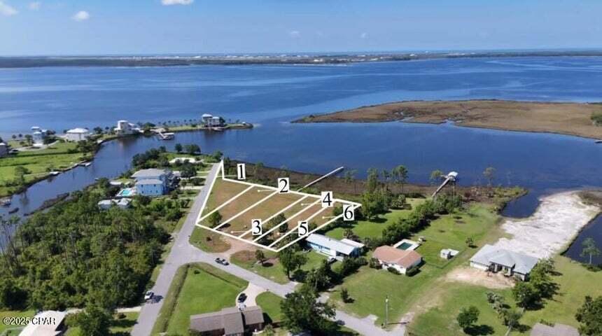 Waterfront Lot with Gulf Access - Rare Opportunity in the Panama City area. Discover the perfect blend of seclusion and convenience with this stunning waterfront lot located in Callaway on the east end of Panama City. Just minutes from Tyndall Air Force Base and only a 30-minute drive to the white-sand beaches of Panama City Beach, this property offers a peaceful escape while keeping you close to everything the area has to offer. This is one of six prime waterfront lots available—buy one, two, or all six for an incredible investment or development opportunity. Each lot offers direct Gulf access, and this particular lot features its own dock, making it ready for you to build your dream home right away.