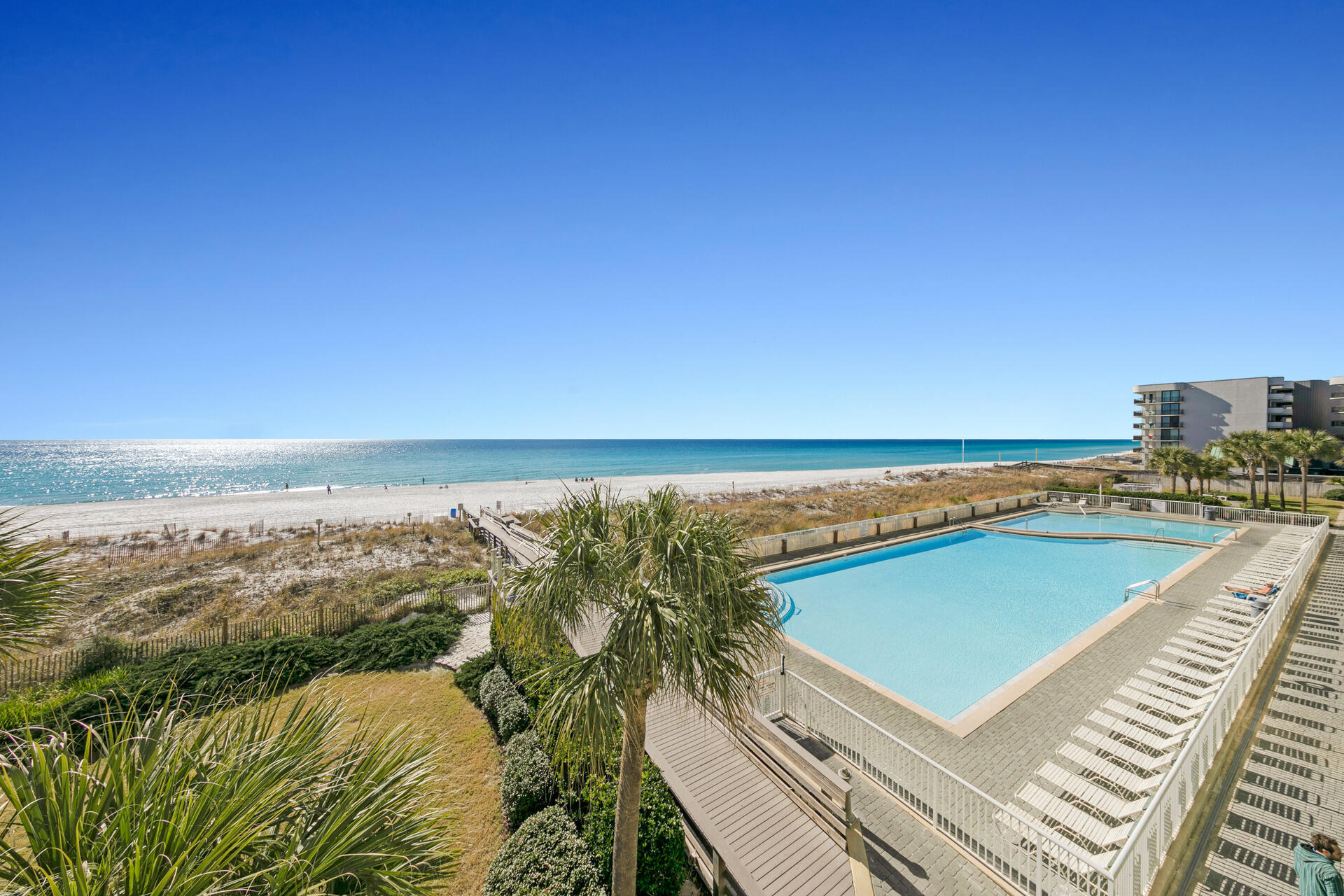 This lovely condo is your ticket to the fabulous beach lifestyle.  Amazing panoramic view of the Gulf of Mexico . You can even enjoy this outstanding view from the master bedroom., which opens up to the balcony. Make family memories and you can also cash in $$$ on vacation rentals.  Sleeper sofa helps you get more heads in beds. Gulf front pool, fitness center, picnic and grill area, and many fun restaurants and attractions in the area.  Easy in and out with parking on the 3rd floor. Buyer to verify information.