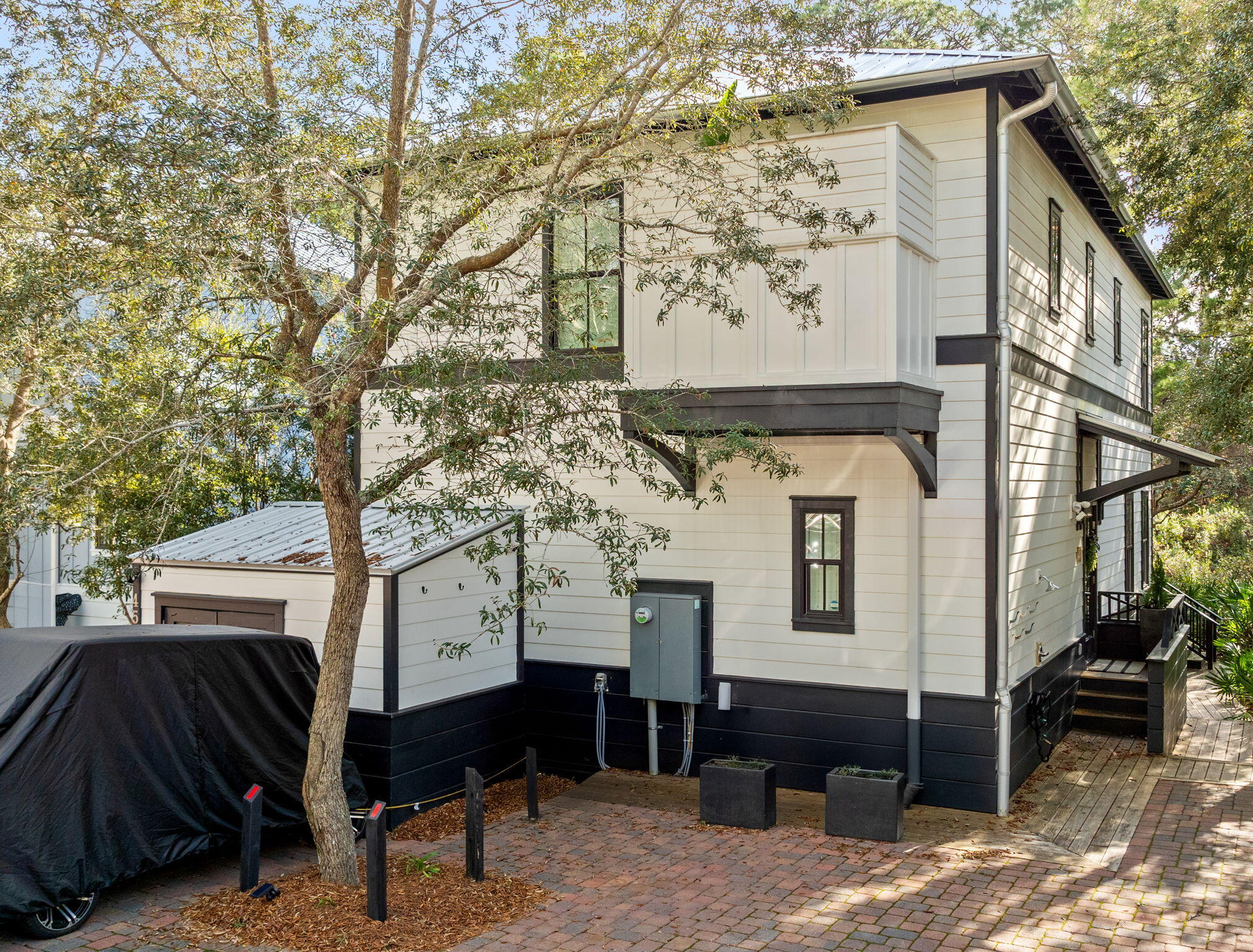 This luxurious Coastal Haven on 30A is a stunningly furnished 4-bedroom, 4.5-bath cottage offering timeless elegance and charm in the coveted Creek Park within Magnolia Cottages by the Sea. 

Each generously sized bedroom features its own private en-suite bath, providing unparalleled comfort and privacy for all guests. Built in 2019 and impeccably maintained, this property combines thoughtful design, premium finishes, and a proven rental history, making it an exceptional opportunity for investors or those seeking a turnkey retreat.

The sophisticated interior boasts quartz countertops, marble showers, shiplap accents, designer lighting, and an additional ice maker in the gourmet kitchen, perfect for effortless entertaining. A screened porch with a cozy twin-size bed swing, dual ceiling fans, and ambient string lights creates a serene outdoor space, while two outdoor showers add a touch of convenience after a day at the nearby private deeded beach access, located 1/3 of a mile away.

This picturesque cottage also includes access to the neighborhood's heated resort-style pool, shared exclusively among Phase 2 homes. Offered fully furnished and move-in ready, this Coastal Haven on 30A is the epitome of beachside elegance and the perfect setting to create lasting memories.