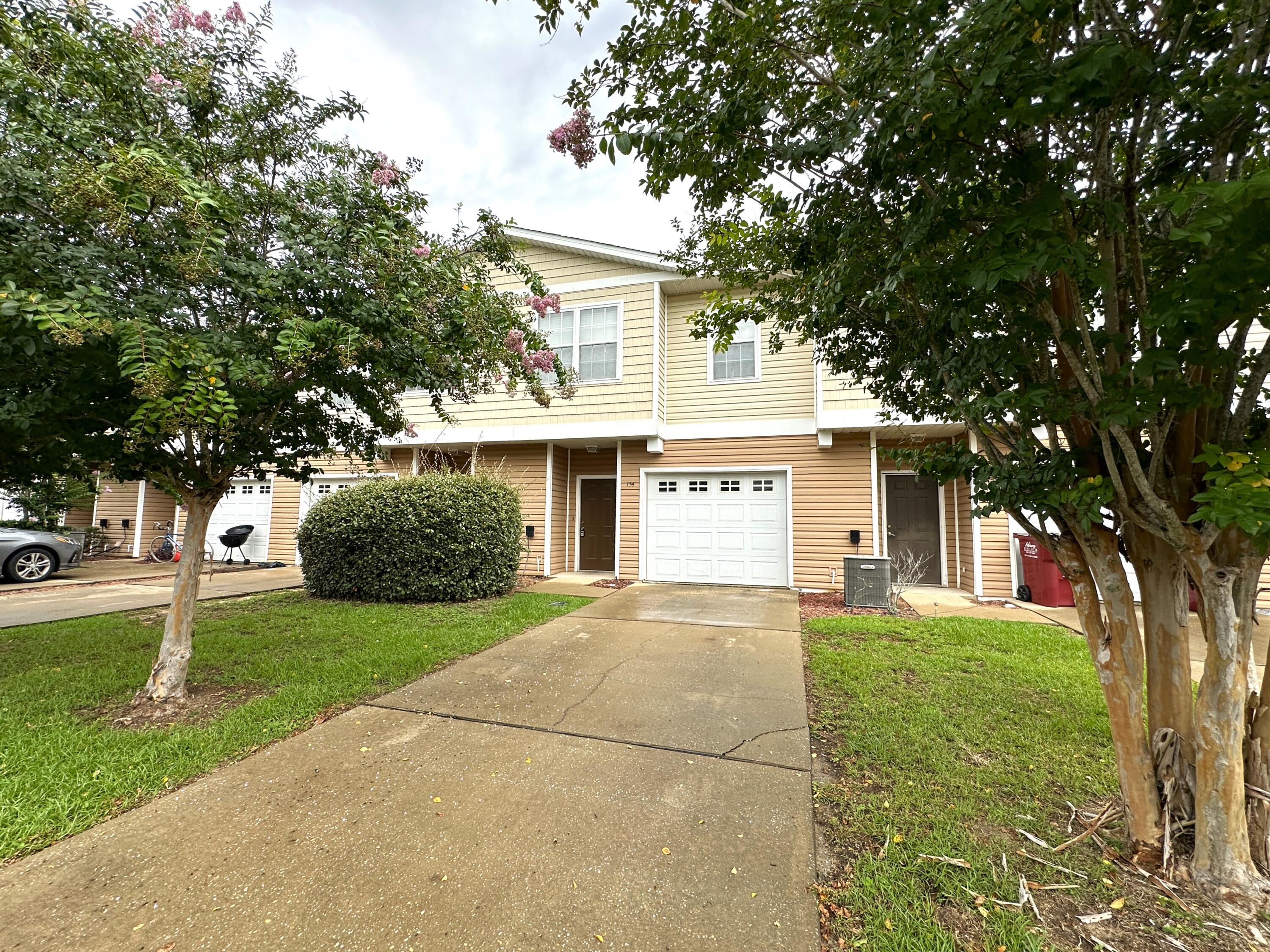 Cute as can be' 3 bedroom townhome in great central Crestview location. Just minutes to shopping, dining, schools and more! This well planned home has 3 nice sized bedrooms upstairs, a spacious and open living area downstairs. The master suite has double vanities and a walk-in closet and there's a 2nd full bathroom upstairs as well. Downstairs you'll find a guest bathroom for your convenience and the kitchen opens to the living room and features a large breakfast bar, stainless steel appliances, and sliding doors to your own covered patio. No worries about yard maintenance here, but there are nice trees and greenery that make the subdivision more desirable. Call today to schedule your showing!