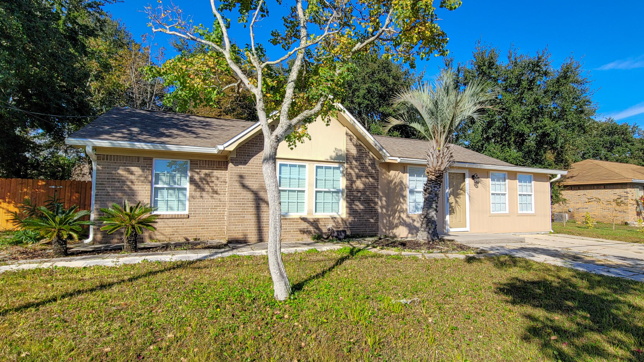 The perfect primary home or investment property! 5 miles from Hurlburt Field AFB. NEW AC, NEW WATER HEATER! Welcome home to this 3 bedroom 2 full bath home with charming & open concept floor plan. Upon entering, you'll appreciate the exposed brick that leads into the living / dining area. The kitchen has a ventless stove on the breakfast bar, large pantry, and a window over the sink. Next to the kitchen is a utility room with w/d hookup + storage. There is a second, larger living space that can be used however you see fit - second family room, multipurpose room, play area, etc  ... Down the hall are 3 bedrooms and a fully renovated guest bathroom with tub/shower combo. The master suite also has a renovated full bathroom with step-in glass shower. NEW DOORS & WINDOWS. See more! Outside, enjoy the newly fenced backyard, TWO large storage sheds, one finished, and both with electricity - perfect for a handyman workshop, office space, she-shed, etc.!!!