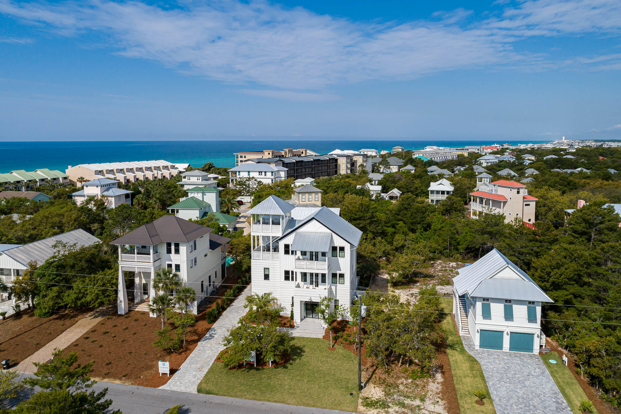 Introducing a brand new, luxury custom residence, poised in a prime location, on the east end of Scenic Highway 30A. This beach home conveys fully furnished, with high-end sleek interiors appointed 30A Design Group. Boasting a uniquely large site with an impressive pool deck and outdoor space for enjoying the coastal lifestyle. With strong annual rental revenue projected at +$250K, the spacious floor plan, with 5 bedrooms plus a bunk room, and an additional carriage house with upper loft, is ideal for large family beach gatherings or for maximizing a strong return on investment, as a vacation rental home. With two large master suites, it is ideal for multiple families to rent together. A short to the beach access, located directly at the end of Seacrest Drive. Just one mile west of Alys Beach, within close proximity to all of the shops, restaurants and lively amenities of Watersound, The Hub, Alys Beach, and Rosemary Beach.  Discover beach life on 30A's popular east end!