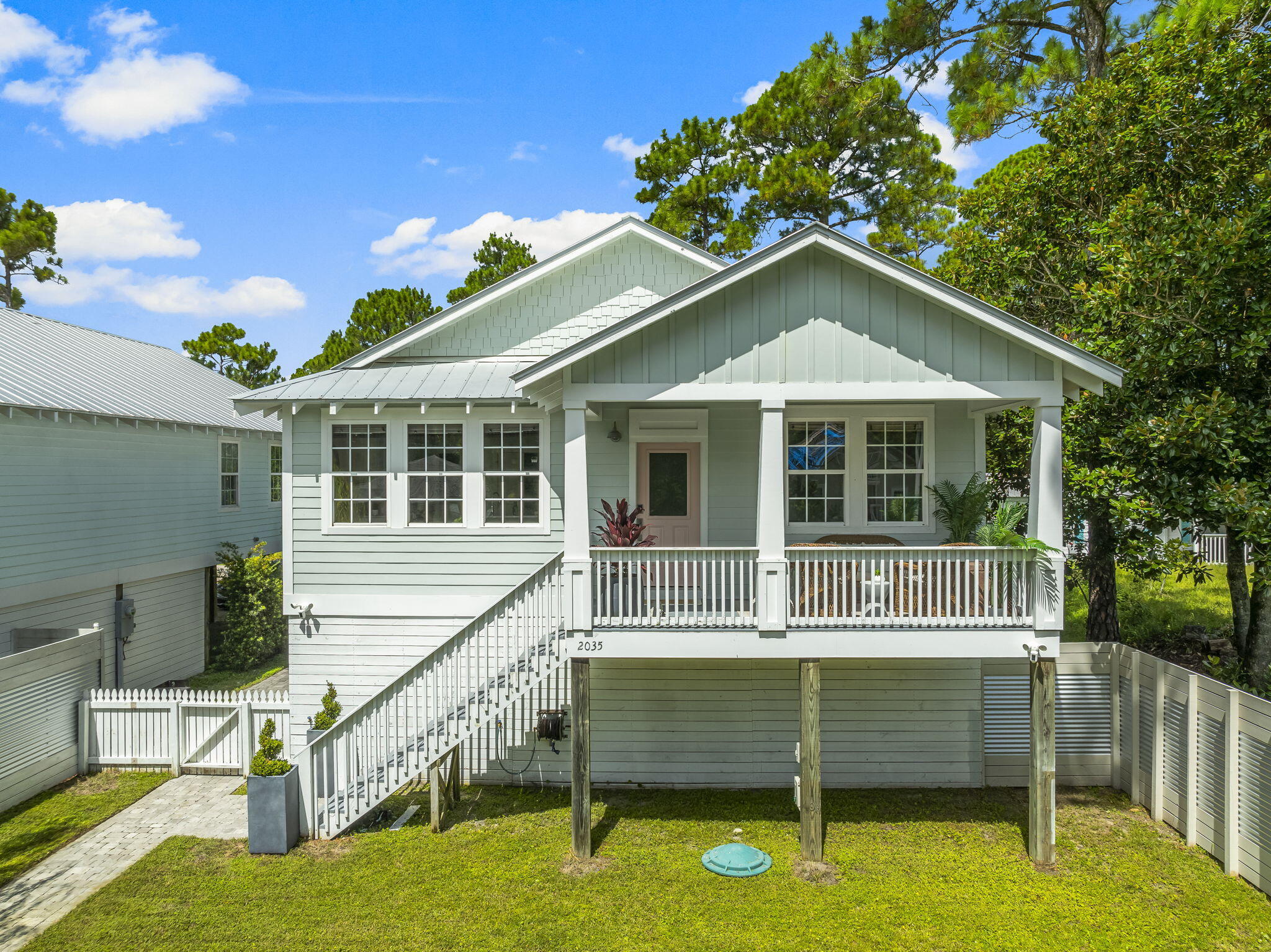 Welcome to The Pink Snapper, a charming 3BR/2.5BA coastal retreat perfectly located just 9 minutes from the beach and 3 minutes from the boat ramp on Hwy 393. This beautifully updated home accommodates up to 8 guests (or 10 with a pullout sofa) and features 2 king beds and 4 bunks, making it ideal for family getaways or short-term rental income. Enjoy morning coffee on the covered balcony porch, outdoor dining in the fenced yard with kitchen and grill, plus an outdoor shower for rinsing off after a day on the water. Your Emerald Coast escape awaits! The Pink Snapper offers the best of coastal living--modern updates, an unbeatable location, and the freedom of no HOA. This 3-bedroom, 2.5-bath Key West-style home is perfectly situated just minutes from the beach, 30A, and the Cessna Landing boat ramp, making it ideal as a full-time residence, second home, or high-demand vacation rental.

Inside, you'll find porcelain wood-look tile flooring, 9-foot ceilings, crown molding, and large custom-framed windows that fill the home with natural light. The open-concept floor plan connects the spacious living area, dining space, and kitchen--perfect for entertaining guests or relaxing after a day on the beach. The kitchen boasts white cabinetry with coastal Key West hardware, marble countertops, new Samsung stainless steel appliances, a large pantry with wood shelving, and a Whirlpool washer and dryer.

The primary suite includes a walk-in closet and a beautifully appointed bathroom with double sinks, marble counters, a tile shower with glass door, and a separate water closet. Two additional bedrooms and a guest bath offer flexible sleeping arrangements, with room for 8-10 guests between 2 king beds, 4 built-in bunks, and space for a pullout sofa.

Outdoor living is where The Pink Snapper truly shines. Enjoy coffee or evening cocktails on the covered front balcony porch, then gather for cookouts in the fenced backyard complete with a prep sink, fridge, grill, and outdoor dining area. An enclosed outdoor shower with hot and cold water adds the perfect touch for rinsing off after the beach. Under the home, a concrete slab provides ample covered parking plus a custom storage area with wood shelving and electrical outlets. The property is also equipped with a 30-amp RV connector, adding flexibility for guests, visitors with campers, or additional vehicle hookups.

Every detail has been considered for comfort and efficiency with updates including a 2024 Trane A/C system, 2023 tankless water heater, 2024 stainless appliances, spray foam-insulated attic with walkable storage, and a durable 2015 metal roof. The home also includes five exterior Ring cameras with double lighting, solar yard light, and fiber-optic internet via AT&T.

Freshly painted and meticulously maintained, this property offers exceptional value and peace of mind with no HOA fees. Whether you're seeking a coastal getaway, a profitable short-term rental, or your forever Florida home, The Pink Snapper offers the relaxed charm and location that make 30A living truly special.

All listing data is deemed to be correct; however, buyers are responsible to verify information.