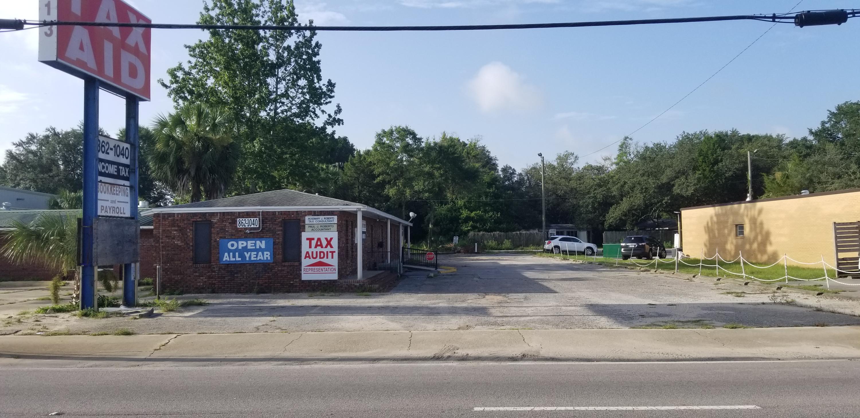 Property has great visibility and within 250 of major stop light intersection at Eglin Pkwy and Racetrack Rd.  Front and rear road access.  Building could be used for office or retail.  Has 2 open large rooms, 2 small offices, 1/2 wall room dividers, and 2 restrooms.  2 AC units and 2 entrance doors.  Large metal business sign.  Over 49,000 cars per day go by this site.  Zoned C-3 Commercial.