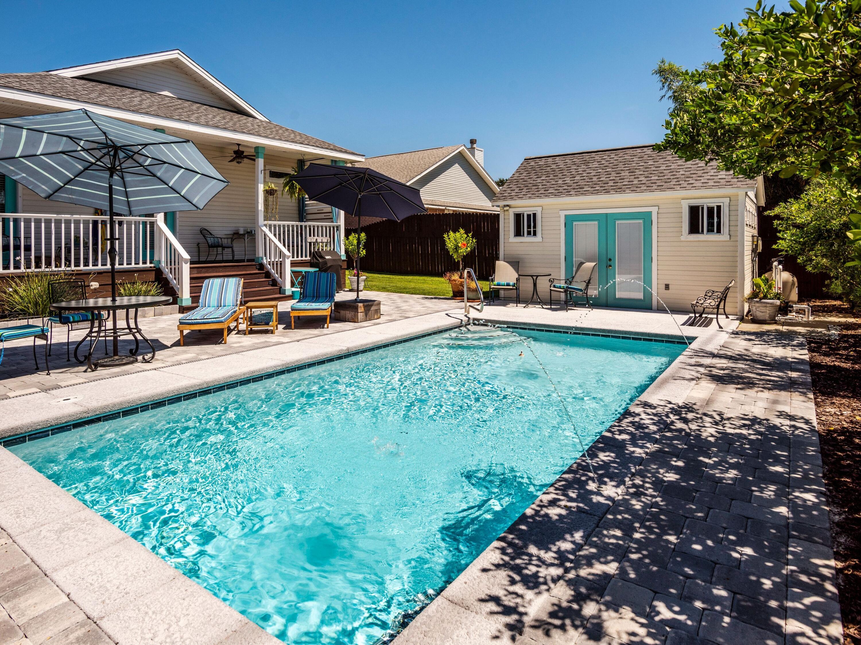 Nestled within the charming community of Sunsail in Crystal Beach, this idyllic beach cottage is ready for it's next owners to build memories within. Spanning just over 1,500 square feet across three bedrooms and two baths, this artistically inspired cottage offers a picturesque place to enjoy beach life at its best. Featuring wide cut tile flooring throughout the main living and bath spaces, new granite countertops adorn the freshly updated kitchen as well as custom appointed bath spaces.  Southern charm is found throughout the open concept floor plan providing outdoor living spaces on both the front and rear of the home. Enjoy morning coffee on the front porch swing, while an expansive backyard space provides plentiful covered seating, a spacious deck surrounding the brand new salt water swimming pool, and a well-manicured yard for children and pets. An additional storage building with french doors located adjacent to the pool provides a fantastic opportunity to refinish the space as a pool house.  Located only a few blocks from the beach, and a short drive or bike ride away from the bustling Destin Commons commercial spaces, convenience and charm are both a top priority at this fantastic home.