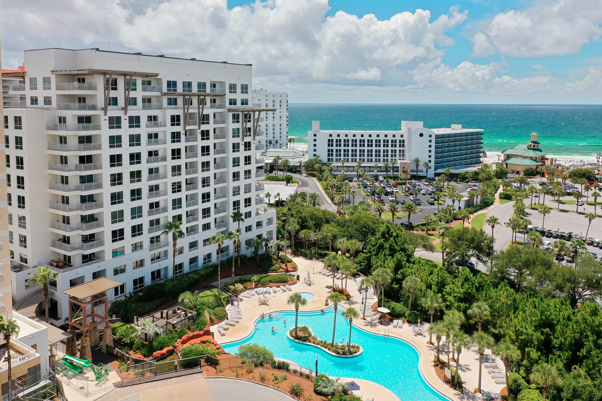 Coastal living & investment potential at Luau Tower II in Sandestin Golf & Beach Resort. Enjoy the best of the beach and the benefits of ownership with this updated 2-bedroom, 2-bath lock-off condominium. With partial Gulf views and vibrant sunset backdrops, this property offers a flexible layout that can be used as a full 2 bedroom home or divided into a 1 bedroom and studio, allowing for a range of living or rental possibilities. Inside, the residence features custom cabinetry, a beverage bar, stainless steel appliances, new countertops, and updated baths. The private balcony provides space to relax, take in the breeze, and enjoy the open views. Offered fully furnished and ready for occupancy or rental use, it's a turnkey opportunity for both enjoyment and investment. Luau's lagoon-style pool with grotto waterfall is a centerpiece, complemented by a hot tub, fitness center, outdoor grilling area, and covered parking. Seasonal amenities include a tiki bar and a children's pool, with shaded seating areas throughout the property.

Located within the 2,400-acre gated Sandestin Golf & Beach Resort, residents and guests have access to accessible beach paths, four golf courses, tennis courts, a full-service marina, shopping, dining, and entertainment at The Village of Baytowne Wharf, plus miles of walking and biking trails. The Beach House restaurant is conveniently located across the street. With its combination of location, resort amenities, and adaptable design, this Luau Tower II condominium is well suited for personal enjoyment, short-term rental income, or a balance of both.