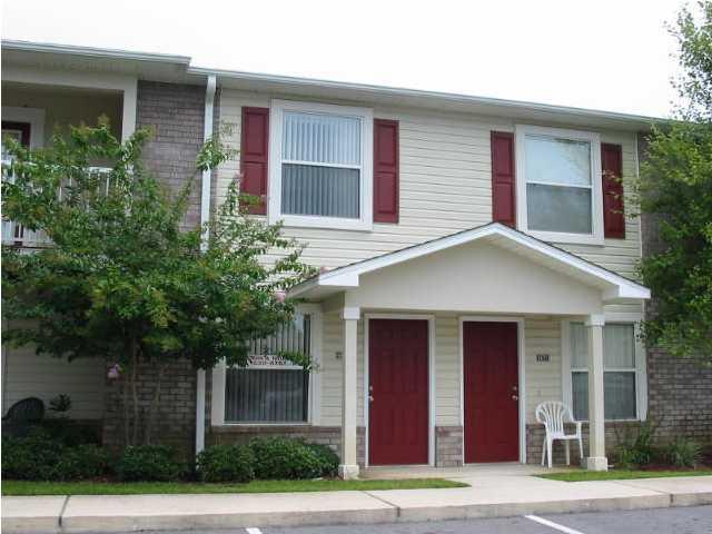 This nearly new Townhome is one of the largest in the complex and has 2 FULL bathrooms, one for each bedroom. Has tile floors in living and kitchen, and newer paint. Come into a spacious living room, and look into the kitchen with a counter bar. There is a half bath downstairs for guests. A large laundry room with a pantry toward the back. It backs up to a small green area with a small patio out the back door. The upstairs has 2 bedrooms each with a private bath. There is a pool and huge party room a few steps away, but far enough there is little to no noise. Don't miss this beautiful well cared for place.