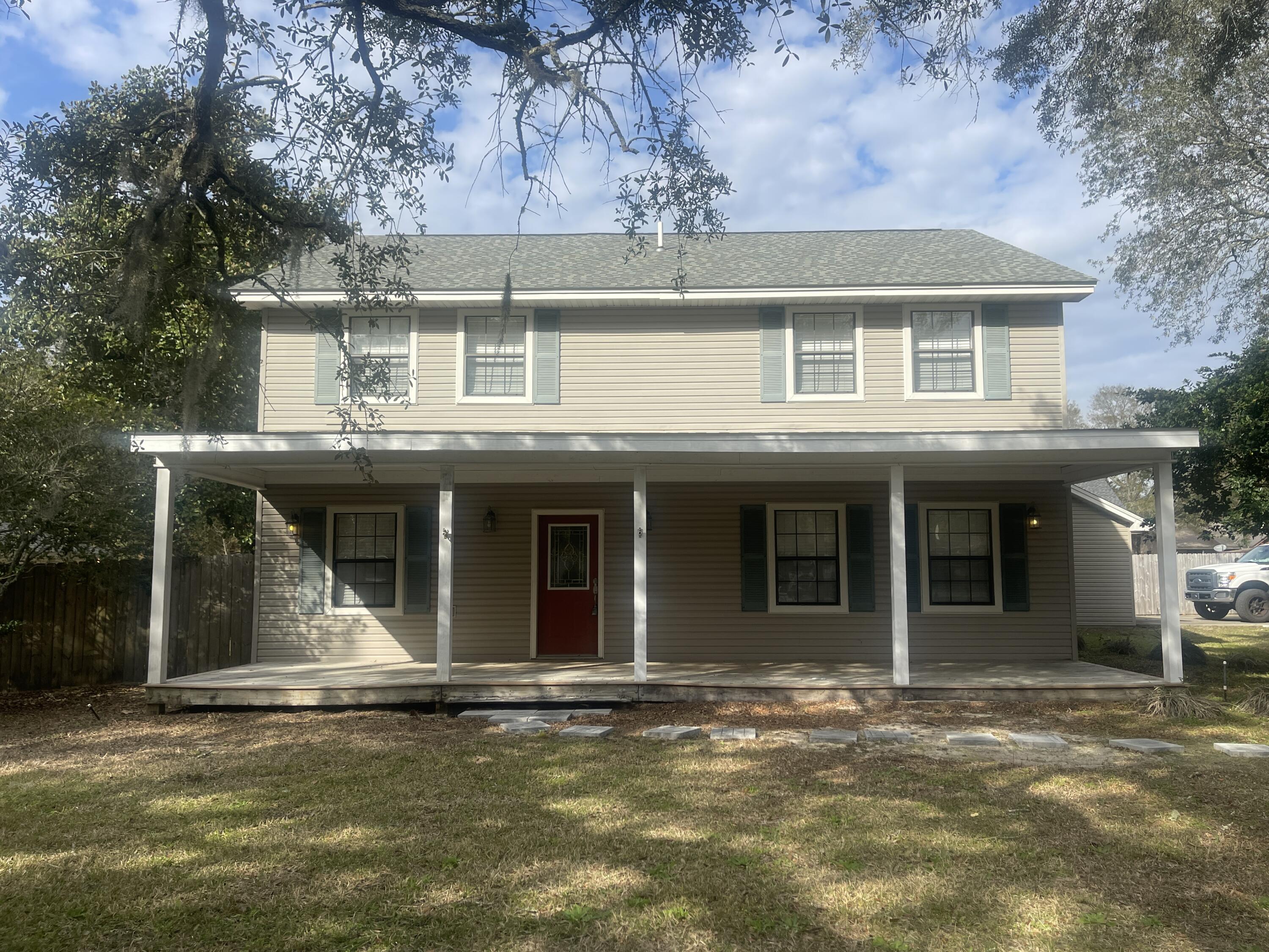 This lovely home is nestled on a HUGE corner lot in the heart of Niceville. Outside there is a charming covered front porch, a side-entry, detached garage, a partially covered/part open back deck, storage shed, and swing set in the huge privacy-fenced back yard. Inside and on the first level are a spacious living room, eat-in kitchen with plenty of cabinet/counter space and stainless appliances (including a smooth cooktop stove), a formal dining room, and laundry room, as well as one bedroom with its own full bath. Upstairs are the primary (complete with walk-in closet and en suite) and two additional bedrooms, each with their own full bathrooms. Pets are not allowed No smoking, including vapes.