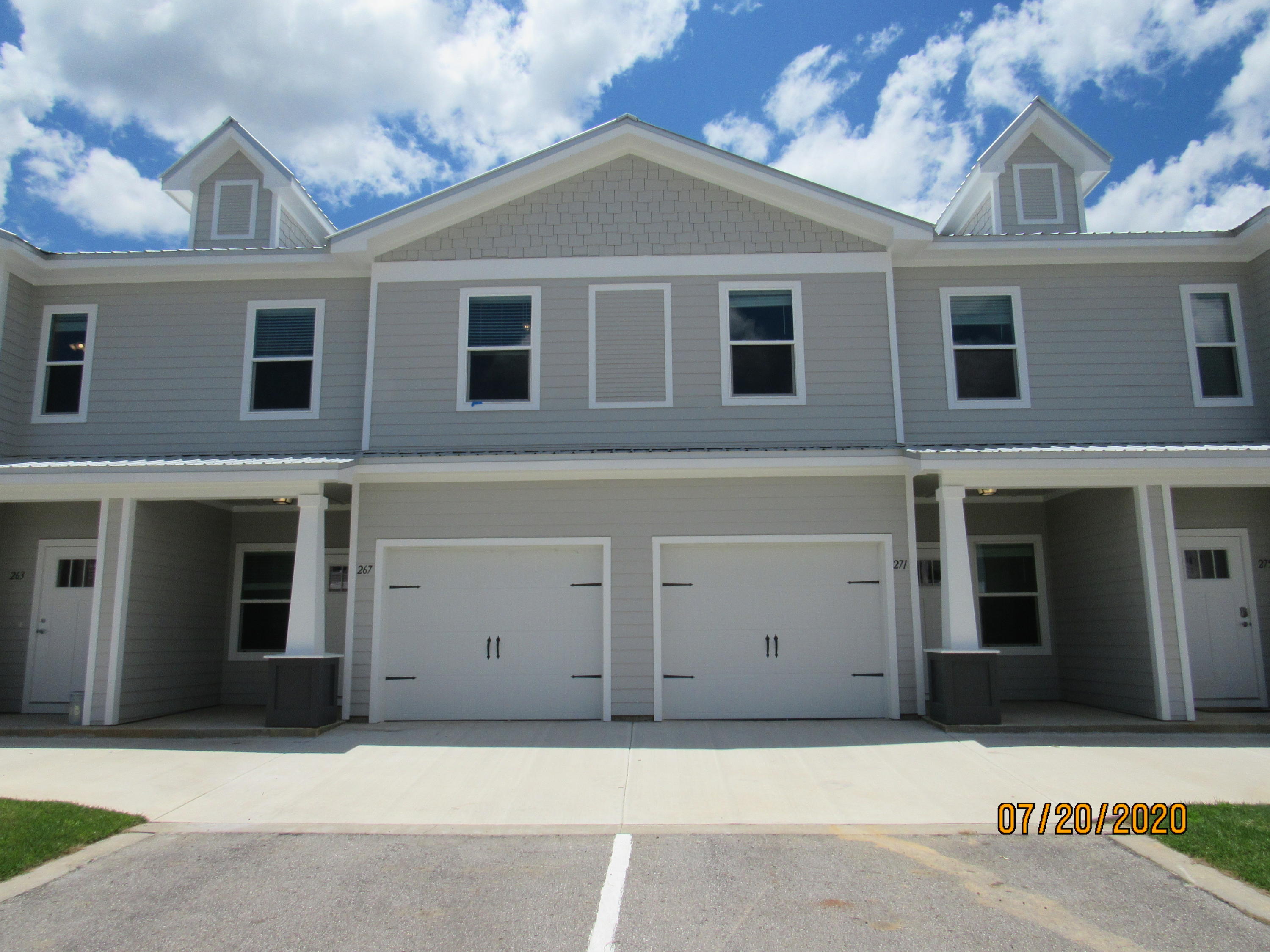 Immaculate, 2020 built, 3 bedroom, 2.5 bath town home with every available upgrade, a GARAGE, and a community pool! This lovely home is across the street from an elementary school, just down the road from a Publix shopping center, and a short, easy commute to the sugar sand beaches and emerald waters of 30a/SOWAL. It has fresh, neutral paint and no carpet throughout. The open floor plan on the first level includes a nice size living room with nook, eat-in kitchen with breakfast bar, quartz counter tops, plenty of counter/cabinet space, stainless appliances (including a flat cook top stove), beautiful backs splash, and pantry as well as a half guest bath with pedestal sink and a screened-in back porch overlooking a green area. Upstairs, you will find the master bedroom, complete with a walk-in closet, as well as a luxurious en suite with double vanity, quartz counter tops, and stand-up shower as well as two guest rooms (one with a walk-in closet) sharing a full guest bath and the laundry hookups. There are plenty of closets and also attic for storage. Pool care, lawn care, and garbage included in the rent. Pets may be considered on a case-by-case basis with prior owner approval and a non-refundable pet fee. NO SMOKING.