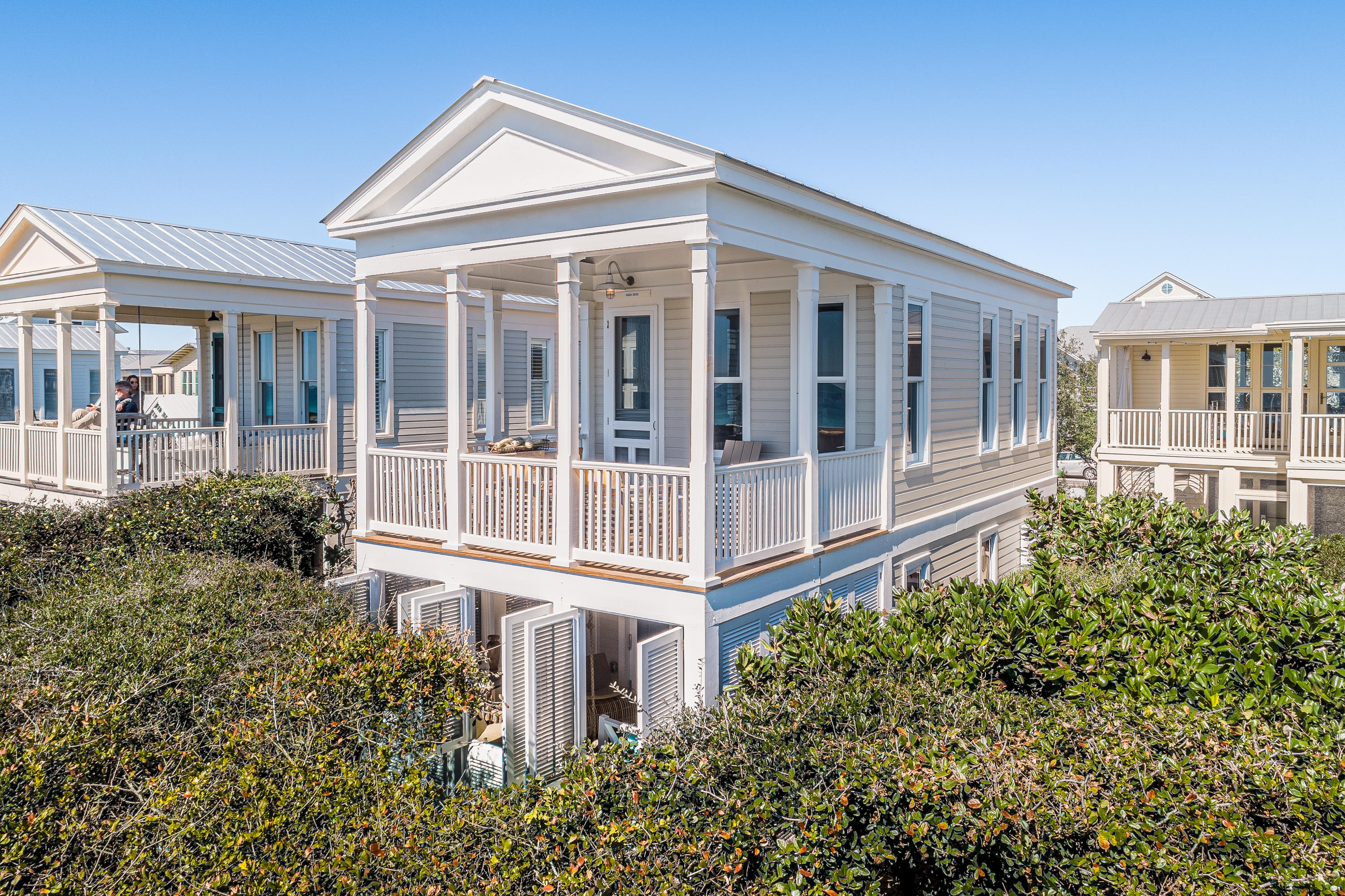 Located in the award-winning community of SEASIDE, FLORIDA - selected by Time magazine as one of its ''Designs of the Decade.'' This classic Florida beach cottage was modeled on Thomas Jefferson's Cottage at Monticello. A two-story cottage beautifully set into the dune, is a finely crafted yet unpretentious hideaway. Designed by Scott Merrill, it was awarded a National American Institute of Architects Award of Excellence.
Your first step into this lovely home will bring a sense of calm not felt before. Completely gutted and remodeled, the quality is immediately, yet subtly apparent. No expense was spared anywhere in this little gem! The all wood interior is painted a crisp white and adds a bright and cooling ambiance to the home. Super Heating and Sub Cooling ensure year- round comfort, while all brand-new storm-rated impact windows and doors provide peace of mind. 

   The first floor is comprised of the entire master suite.  An oversized walk-in shower and a like-sized half-bath with "curbless" entries, are screened with a beautiful opaque sea-inspired blue/green floor-to-ceiling plate glass to give light and spaciousness.  Custom tile was used extensively throughout the bathroom.  The floating vanity with soft-close drawers discreetly hides toiletries, etc. while the full-wall mirror further creates a sense of expansiveness.   The bedroom is designed to soothe - a king size bed with luxury linens becomes your peaceful oasis.  Stunning, custom cabinetry lines the wall offering plenty of storage, and an LG washer/dryer is neatly tucked away out of sight.   Slide open the NanaWall Glass Doors and nearly double the bedroom size by revealing a 14'x12' porch.  Completely enclosed by custom-made, operable shutters, you can either throw them open to the wind, or close for complete privacy while you nap on the oversized porch swing.  Surrounded by a natural grove of scrub oaks ensures no one will disturb you.

   The second floor displays a large, open layout with a magnificently designed and appointed kitchen, dining nook, and upscale yet comfy living room.  Many large windows surround the entire second floor, bathing the home with plenty of natural light and stunning Gulf views!  Custom kitchen cabinets shine with a soft glow and neatly tucks it all away.   High-end appliances include a Wolf Induction stovetop, Bosch convection oven/microwave combo, Bosch dishwasher, refrigerator and freezer drawers, and Silestone countertops in kitchen (and bathrooms).  But the real showstopper is the generous porch overlooking the sugar-white sands and emerald green waters. Lose yourself to the sound of crashing waves and the playful displays of our beloved porpoises!

HONEY "B" is offered fully furnished (less a handful of items) and is turn-key ready for your immediate enjoyment.