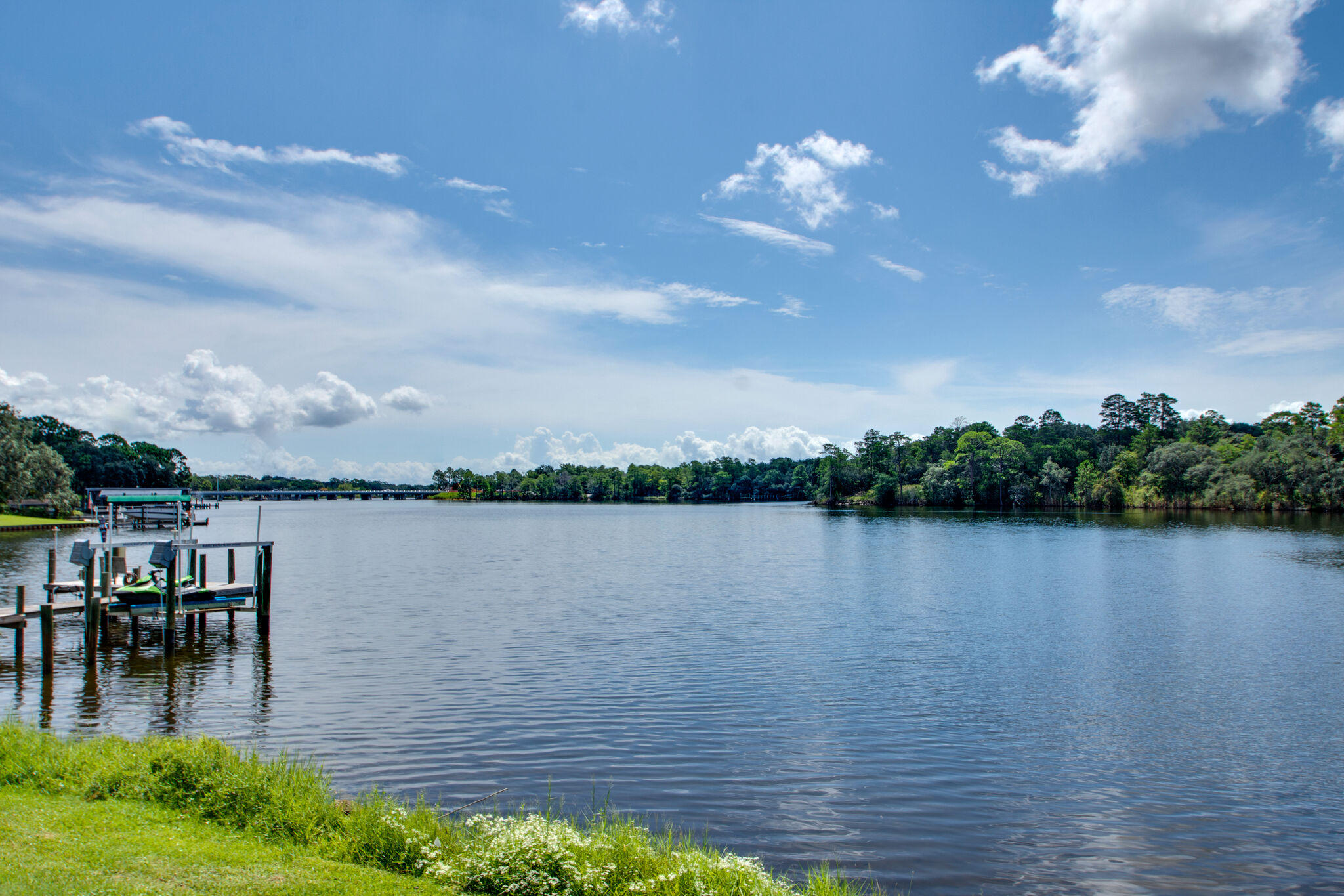Wake up every morning watching the dolphins play in Tom's Bayou right from your own living room.  This stunning 3 bedroom 2.5 bath waterfront home has been beautifully upgraded with tile flooring throughout the downstairs, granite countertops, and a stunning master bathroom with dual vessel sinks and a custom walk-in shower with three showerheads. This is an end unit and it sits directly next to the community green space and dock  giving you both quiet and privacy, and the feel of having a great back yard (with no grass to cut)! The Hidden Cove community offers a large pool, community room, fitness room and a community dock with boat slips available for residents to rent (separate fee). Pets may be approved with some restrictions and a non-refundable pet fee. Call for an appointment TODAY!