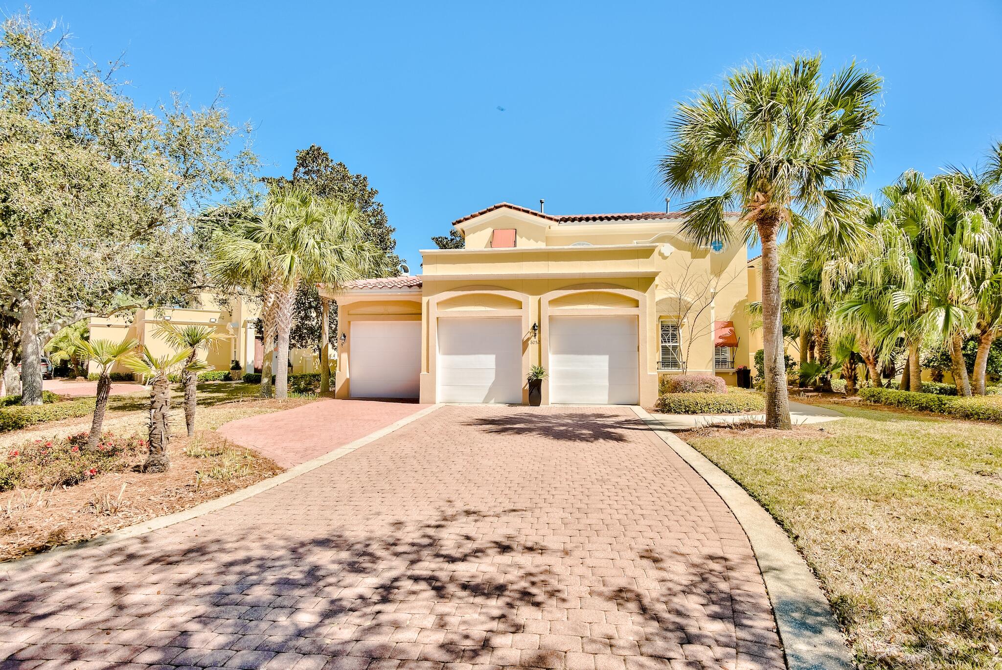 Waiting for a Fountains home in Sandestin?  This is the one!  Boasting lake and golf course views, this home has a two-car garage with an additional golf cart garage, all with epoxy floor coating.  3 bedroom, 3.5 bath, this home has a remodeled FIRST FLOOR MASTER featuring a large bathroom with walk-in shower, separate tub and a highly sought after large walk-in closet.  There is also a spa located just off of the master.  The kitchen is appointed with stainless steel appliances, gas stove with double ovens, tiled backsplash and a breakfast bar.  Generally, homes in the Fountains lack sufficient storage, but this home provides tons of storage throughout including the extended laundry room with dual temperature-controlled wine refrigerator, full-sized stacked washer and dryer, see MORE extensive built-in cabinetry and a 2nd refrigerator.   There are two office areas that are perfect for those working from home.   Convenient location to the Village at Baytowne, tennis and full-service marina.  And it's just a quick golf cart ride to the beach, shopping and dining at Grand Boulevard.   Photos were taken before the furniture was removed.