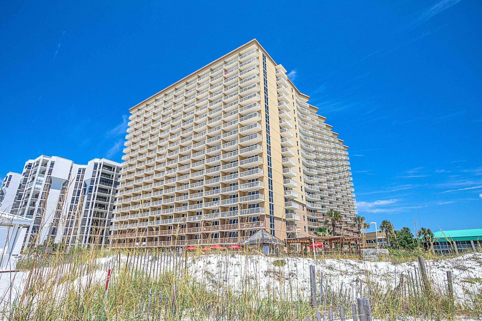 BEST PRICED in Pelican Beach! Incredible opportunity to own a 1 bed + BUNKS condo at Pelican Beach! Located directly on the famed beaches of Destin...enjoy sun-splashed days of swimming, biking, and relaxing before coming home to this super spacious 1 bedroom condo with incredible Gulf views. This beach inspired condo offers a large master suite with a private bathroom, hallway bunks, and a guest bath. This condo is fully furnished and rental ready. Unit 106 has stunning Gulf views from the balcony and not to mention overlooks the NEW beachside 114 ft zero entry pool with a 12 seat spa! Also, first floor means NO elevator waits and quick access to the beach! Pelican Beach is centrally located to all the dining and entertainment Destin is famous for including spas, shopping, golf, fishing and more! Pelican Beach has an amazing resort style amenities, including: three swimming pools (one indoor), tennis, hot tub, huge sun deck, beachfront grill, fitness center, building security system with cameras, upgraded cable and super high-speed internet, on-site cafe and market, 24 hour reservation desk, convention/meeting services and covered parking garage!  This unit is ideal for a beach getaway or investment property! Coastal living at its finest!