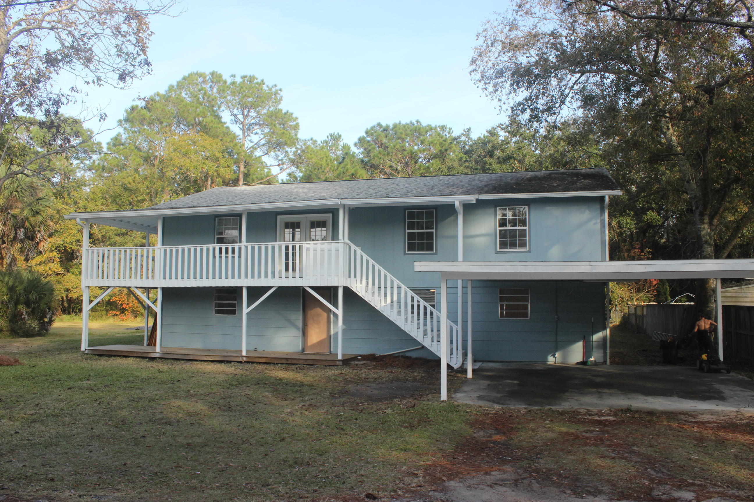 Country living at its best and south of the bay. The house has deeded bay access with a dock. This rustic home offers a unique layout with plenty of space for a large family. Downstairs can be used as a mother in law suite as it has it's own separate entrance. The upstairs features 4 bedrooms with brand new carpet in the Master Bedroom. The kitchen and dining area have tile and black granite counter tops. The home is located just a mile from the South Walton High School and Public Library.