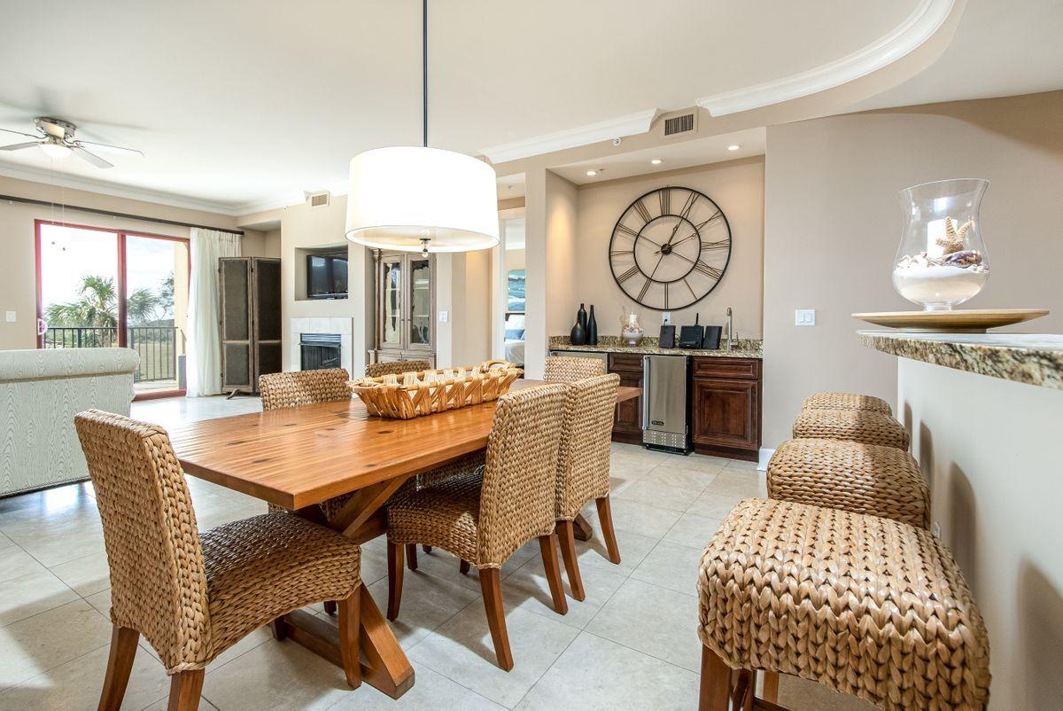 Welcome to Sanctuary by the Sea Unit 1107, a 3-bedroom 3.5-bathroom condominium, with 2251 sqft. The harmony of the Gulf of Mexico and the Coastal Dune Lake views are undeniably beautiful and can be enjoyed from the master bedroom and living room. Ideal as primary residence, second home or as a vacation rental, this condo is ready for a new owner with fresh paint, new ac unit, and new flooring. The gourmet kitchen features a pantry and Viking Professional gas range with oven, vented hood, and stainless-steel fridge. Separate wet bar with sink, ice maker, and wine fridge are perfect for entertaining. Throughout the residence are 10' ceilings and granite counters. Residing on 23 acres, this 4-story Mediterranean style Gulf-front Gated condominium building has only 82 residences. Sanctuary by the Sea is amenity rich, offering activity as well as serenity along Hwy 30A. This resort property has a boardwalk to its 650 ft. of owned beach on the Gulf of Mexico, and lake-front dock for launching kayaks or paddle boards to the beach. There are three resort swimming pools with fountains and waterfalls, state-of-the-art fitness center, movie theater, video arcade, Virtual Golf Simulator, fully furnished Owner's Lounge with gourmet kitchen, two outdoor whirlpool spas, two outdoor gas fire pits, poolside grills, covered parking garage, 7 temperature controlled elevators, bike racks, and 24/7 security.