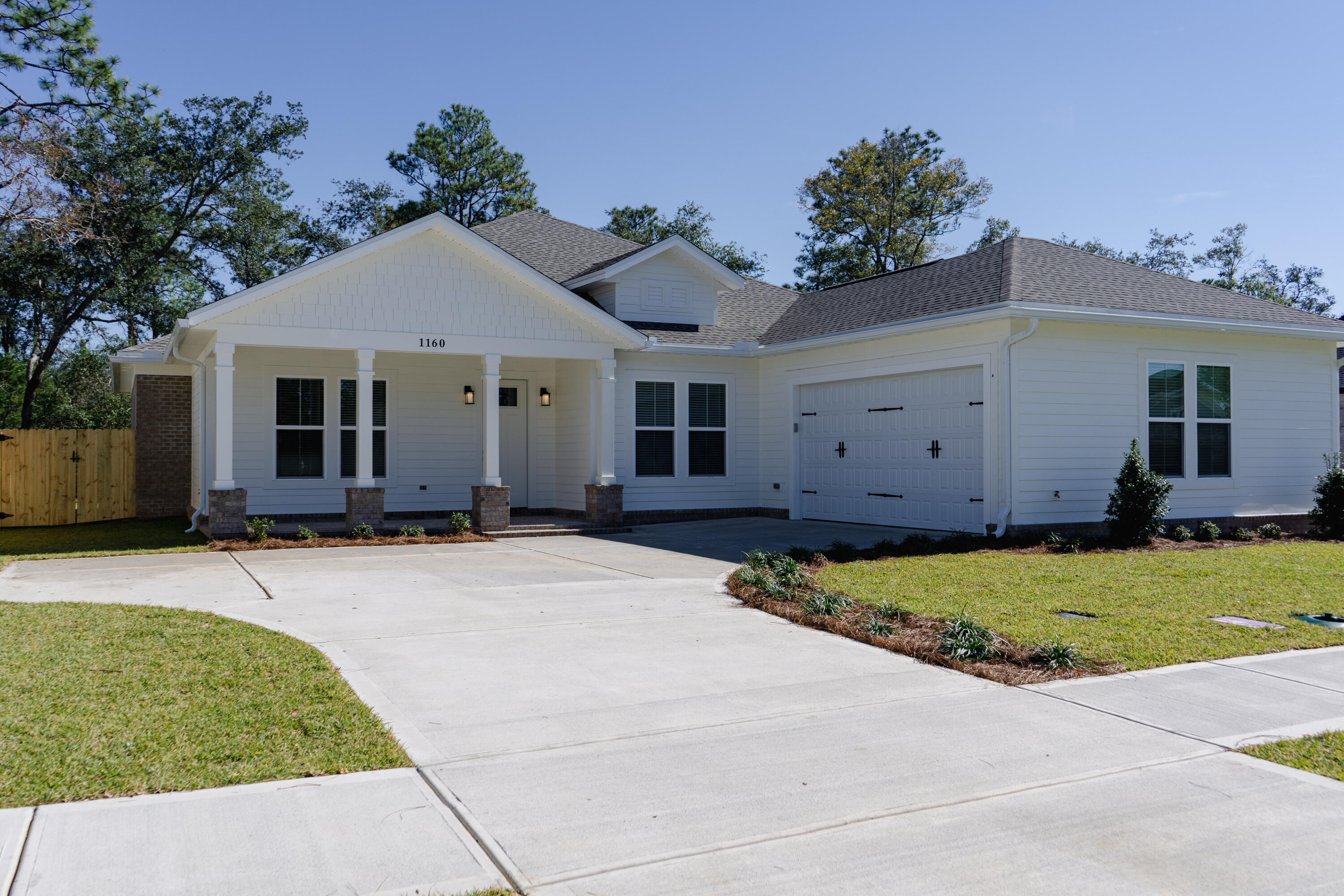 Spacious, new Craftsman home in the new community of Deer Moss Creek in Niceviile, FL. 1 story, 4 BD w/ 3 full  ensuite baths with the home backing up to the Eglin Preserve, so all private behind this home.  Home boasts many desirable upgrades. Open main living area floorplan, with a wet bar & wine frig. Custom, Craftsman-Style  trim work through out the home. Large kitchen island w/ refrigerator, shiplap trim and huge. walk-in pantry. Spa tub & walk in, tiled shower in the master bath.  Small built in desk in master. Cabinets and sink in the laundry room.  Rinnai Tankless water heater. Spray foam insulation, to reduce energy costs. LVP flooring in all rooms, tile in the baths and laundry. Covered back porch with brick flooring, 6 ft privacy fence & aluminum back fence. Epoxy garage floor. Amenities for the area will include a nature trail, pool and club house, basket ball court and children's park, Phase 3 Town Center  will have a commercial area with shops, restaurants, grocery store and office space.