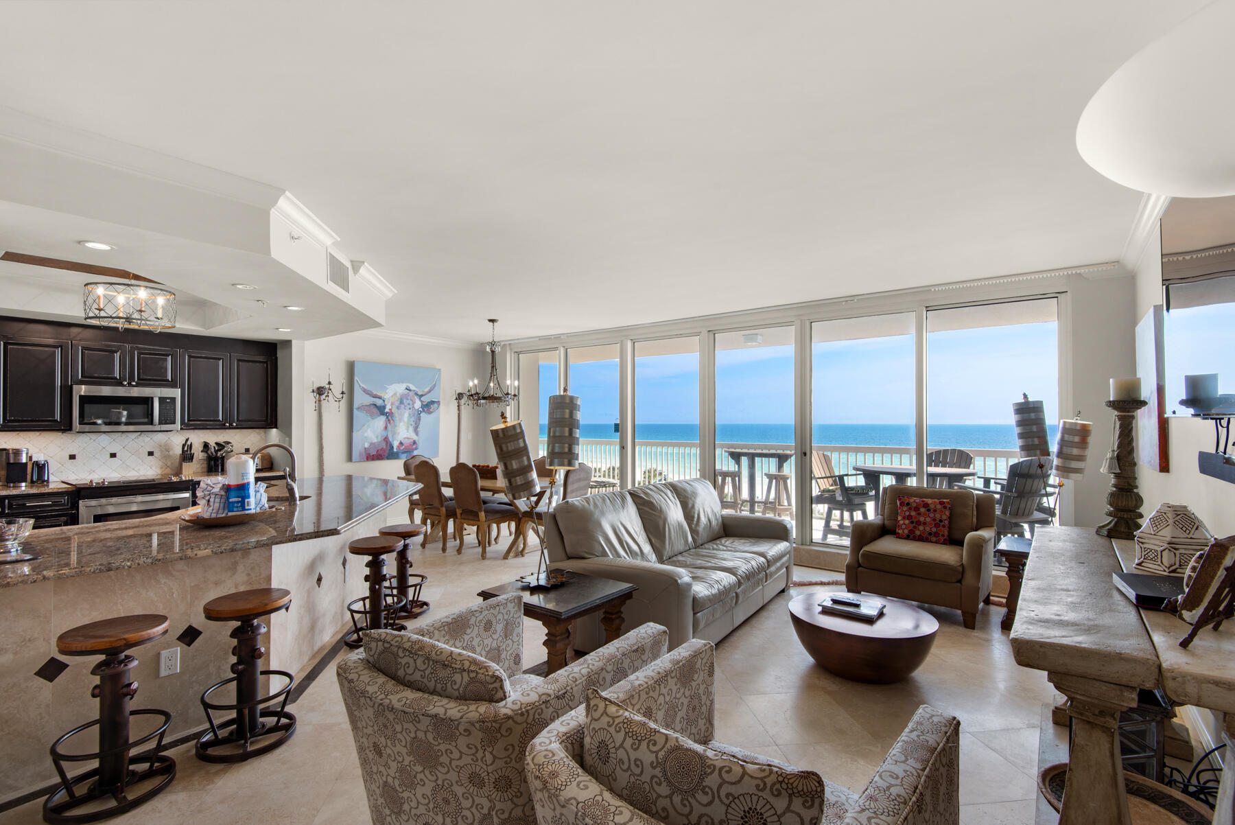 This beautiful 6th floor condominium offers stunning Gulf views and luxurious finishes throughout. The main areas, including the living room, dining room, kitchen, hallways, and bathrooms, feature elegant travertine flooring. All three bedrooms are adorned with hardwood floors, adding warmth and character to the space. The three bathrooms have been meticulously renovated with travertine showers and upscale vanities. The master bathroom is particularly impressive, showcasing a seamless travertine shower, a whirlpool bath, and two separate mirrored vanities illuminated by unique lighting fixtures. The kitchen boasts faux-finished cabinets, stainless steel appliances—including a wine cooler—and granite countertops, providing both style and functionality... Additional conveniences include a spacious laundry room equipped with a sink and a back door that serves as a service entrance. St. Maarten is perfect as a fulltime residence, second home or a vacation rental. The buildings semi-private elevators open directly into the condo. Each unit has a deeded parking space in the garage and climate controlled storage unit. ALL utilities, even electricity, are included in the condo association fee. The Silver Shells Resort, located in the heart of Destin, provides every amenity imaginable including 24 hour gated and guarded entrance, cardio & weight rooms, 4 tennis courts, basketball court, grills and picnic area, a 7500sf lagoon pool, indoor/outdoor heated pool, several hot tubs, the Silver Shells Day Spa and Ruth's Chris Steakhouse. This 27 acre resort, with lots of greenspace, has over 1000 feet of beachfront, a Sand Bar on the beach serving food and drinks in season, and gorgeous sugar white sand beach and emerald green crystal clear water. This unit is ''move in ready''. Nothing needed to begin enjoying the ultimate in beachfront living immediately!