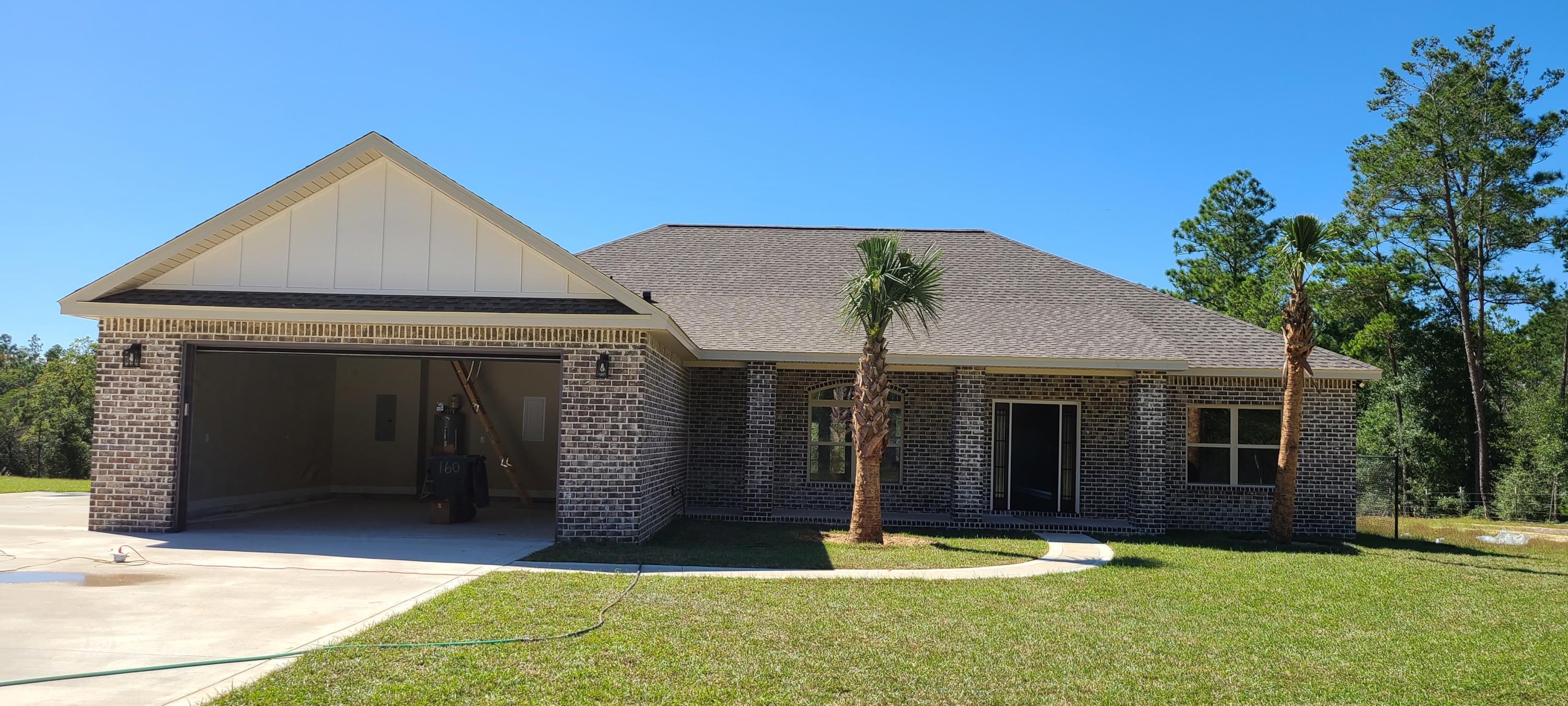 Beautiful large 2565 sq ft All brick home to be built sitting on a 5.42 AC lot. with natural spring fed creek that flows through it. Inside you will find an open concept with a huge family and dining rooms with ten ft ceilings and crown molding. Beautiful kitchen with granite counter tops and stainless appliances including the refrigerator. Cabinets with soft close doors and drawers. Master bedroom is huge and has his and hers walk in closets in the master bath. Master bedroom features a trayed ceiling with crown molding. Additional bedrooms are very large as well. The home has an enormous 27 ft cover front porch and an even larger 33x7 cover back porch for enjoying evening for morning coffee! Still time to choose flooring and colors! Make this your custom dream home!