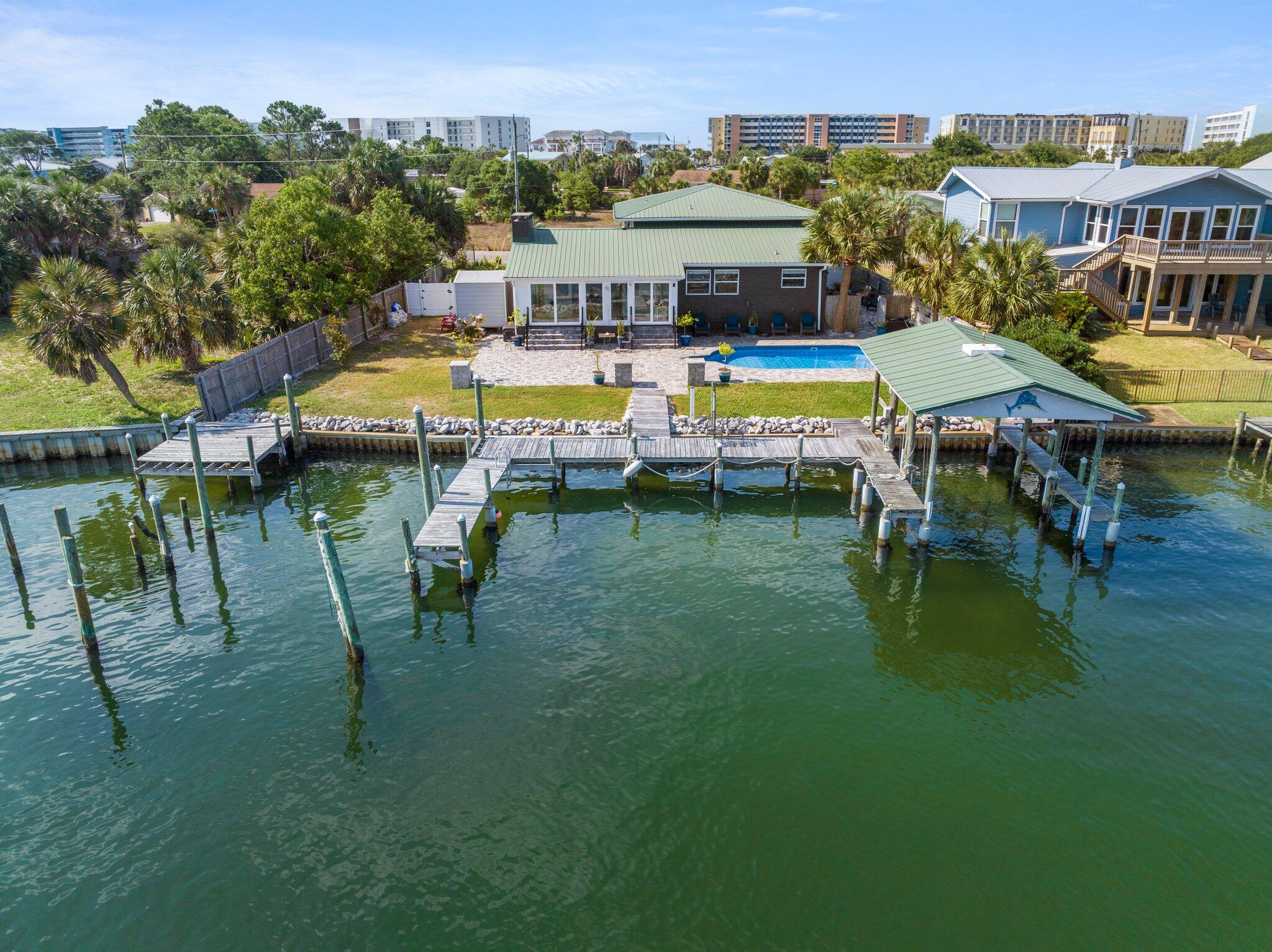 Your WATERFRONT paradise awaits!  This property has it ALL...90' of Deep Water frontage, swimming pool, gorgeous views of Santa Rosa Sound, and a short walk to the white sand beaches of Okaloosa Island.  Inside, the open floor plan features a gourmet kitchen complete with gas stove, large island, granite countertops, and stainless steel appliances.  A spacious living area with gas fireplace and stone surround opens to a second living space ideal for reading/office/game time.  4 Large bedrooms make this a most inviting place to spend time with friends & family.  Too many updates to list, so call for your showing appointment today!!