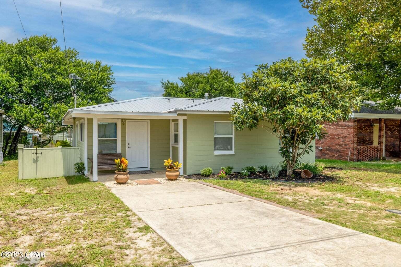UNDER CONTRACT- TAKING BACK-UPS. 
Home is in one of most desirable area, just walking distance to Beach Access 87. SHORT TERM RENTALS ALLOWED NO HOA!!! The property is a cinder block home and completely remodeled!!! It features a charming exterior with a well-maintained yard and a spacious backyard, perfect for outdoor activities or relaxation. Home has new roof of 2020, tankless water heater 2018, and AC dated 2021. As you step inside, you'll be welcomed by a warm and inviting atmosphere. The interior boasts a modern design with carefully chosen finishes and ample natural light throughout. The layout incorporates well-defined living spaces, including a cozy living room. Also includes a functional kitchen equipped with high-quality appliances, gorgeous cabinetry, and under cabinet lighting. Granite counter tops Plus a dining area ideal for both casual meals and entertaining guests. One of the notable highlights of the this property is its proximity to the beach. Just a short distance away, residents can enjoy the beautiful sandy shores and breathtaking ocean views, perfect for sunbathing, swimming, or taking leisurely walks along the coast. This property is conveniently located near various amenities such as shopping centers, restaurants, and schools, ensuring that all your daily needs are within reach. With its appealing features and fantastic location, this property offers a wonderful opportunity for anyone looking to embrace the coastal lifestyle in Panama City Beach, Florida.