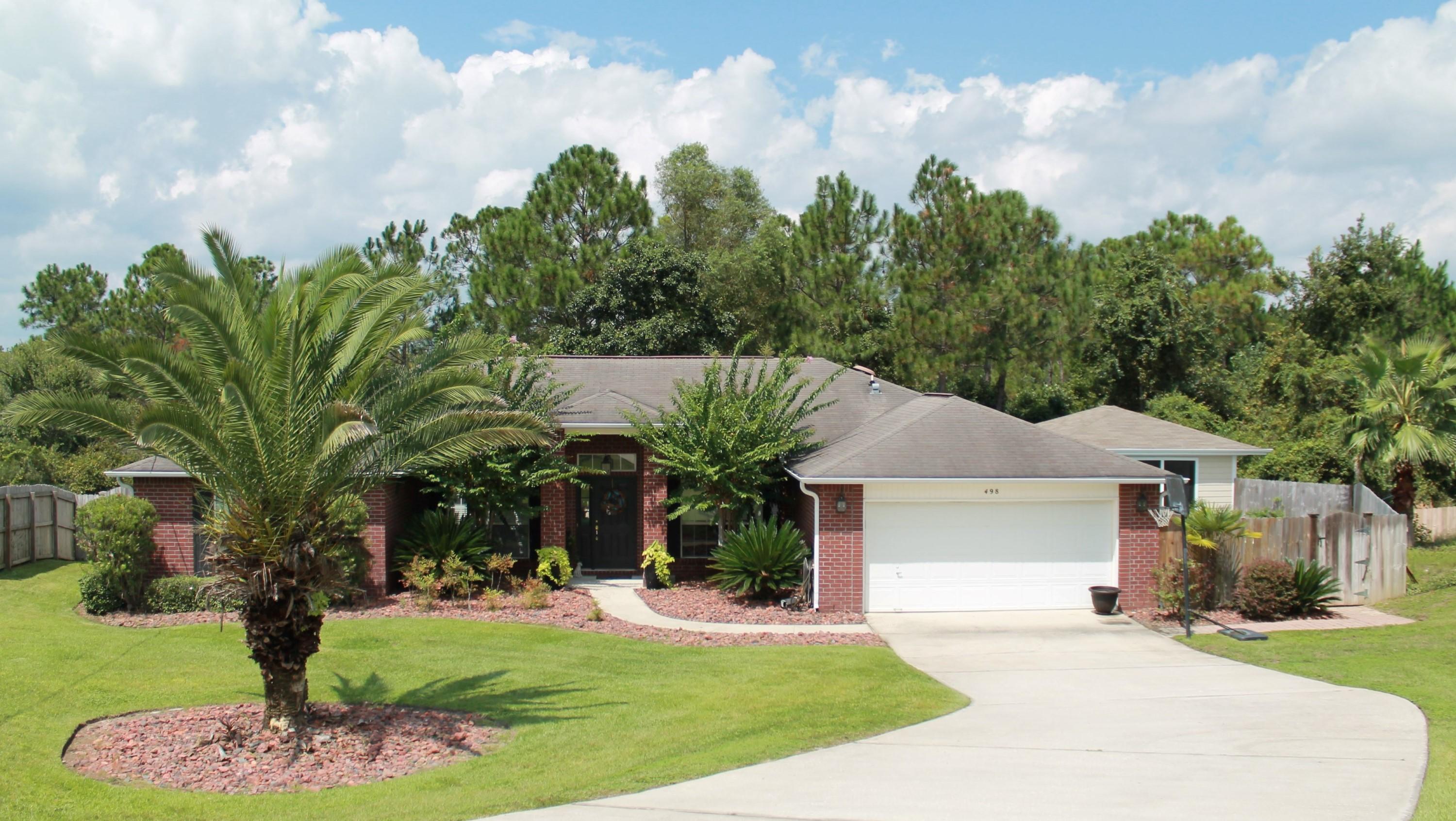 Relax at home w/your Private Retreat! In-ground POOL, Screened Cabana w/Grill, TV, and Mini Fridge, Tiled Pergola w/Balcony and Wooded View, Playground, Paver-stone walkways, and LUSH landscaping! SOUTH of I-10 with a 1 YR home warranty, IMMACULATE one owner home w/CURB APPEAL! Wood flooring throughout w/carpet in the additional bedrooms, upgraded fixtures, granite vanities, elevated ceilings, WHIRLPOOL appliances, media wiring throughout, oversized tile, and MUCH MORE! Office and Dining Room flank the Foyer and opens up to the Living Room w/French Doors to your Beautiful Backyard. Eat-in Kitchen is located off the Living Room. Fully equipped Kitchen w/stainless appliances, breakfast bar, and tons of cabinet/counter space! Schedule your viewing! Master Suite is located off the Kitchen. Master Bath features: Tiled Shower, Double Vanity, SOAKER Tub, and 2 Walk-in-closets. 3 Additional Bedrooms are located off the Living Room and share the 2nd Full Bathroom. Laundry Room has built-in cabinets for storage.  Screened Cabana is wired for 220 Amp Service. Yard Building convey's as-is. 1 Year home warranty valued at $400 with American Home Shield Home Warranty.