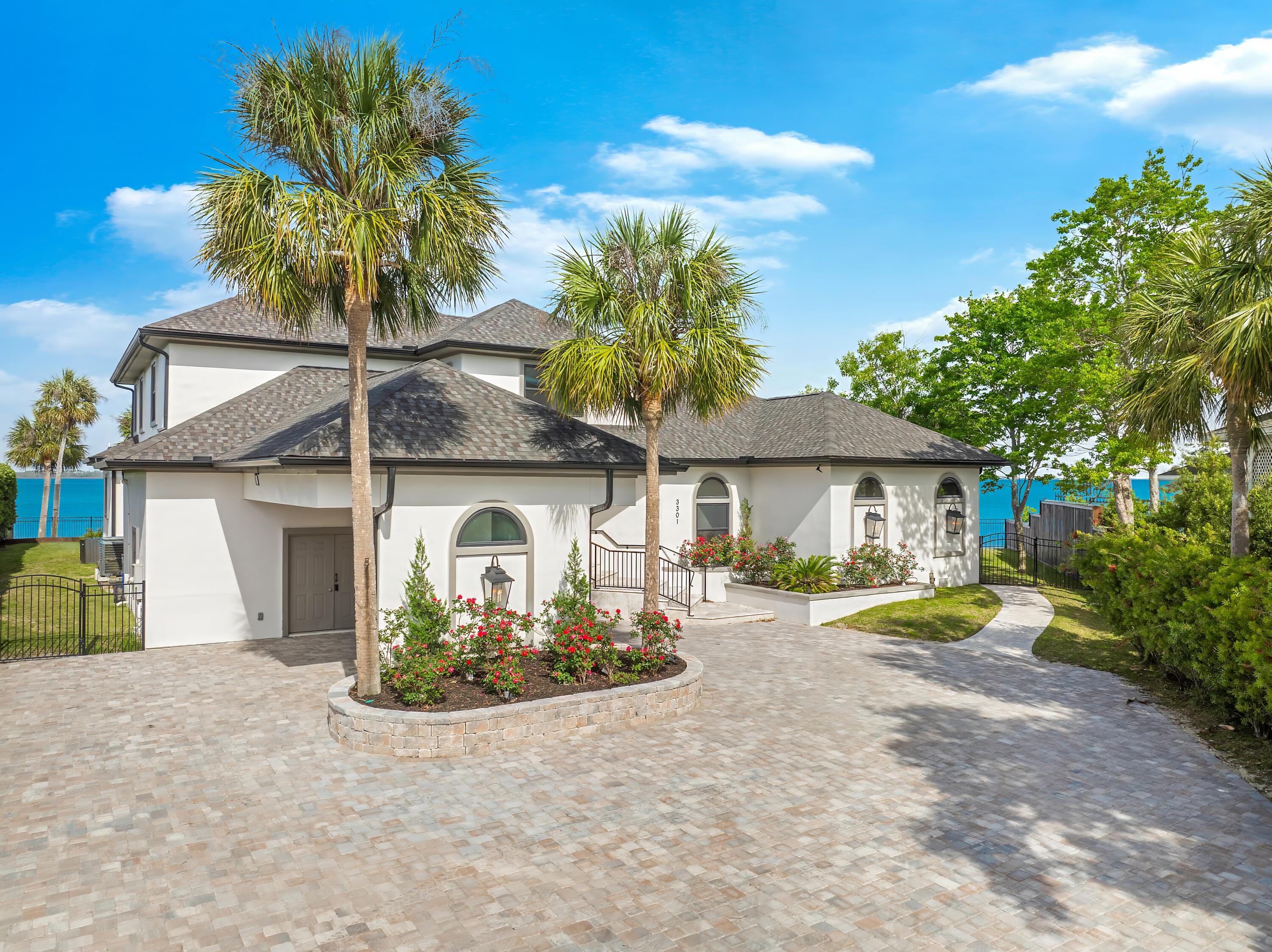 Welcome to 3301 Harbour Place. This one of a kind home is situated in the prestigious neighbored of Kings Point Harbour. This is a rare opportunity to own a property on St. Andrews Bay with 160 feet of water frontage and No HOA! This expansive home boasts of 4,300 sq ft, 5-bedrooms and 4-full baths. Tucked away on a quiet street you will enjoy your privacy and breathtaking views from both the front and back yard. 

As you enter this home you are greeted with panoramic views of St. Andrews Bay. You will appreciate the newly installed ceiling to floor windows that let in all the natural sunlight, views of the sunsets all year long, and dolphins swimming under your dock daily.  This home has been completely redone top to bottom. Some Features that make this home special is a double sided wood burning fireplace, two separate living rooms, a breakfast nook, oversized bedrooms, laundry chute, office, custom built-ins, and a bonus room upstairs.

Stepping outside into your tranquil backyard there is an expansive amount of outdoor entertaining space with a completely renovated 8 ft deep saltwater pool. This property is in the ideal location Being about a 10 minute boat ride to Shell Island and the pass. The dock is 520 feet long and was constructed after hurricane Michael. Please note, The length of the dock is grandfathered in!! Furthermore, it comes equipped with three lifts, water, and electricity. 

Make this your home and enjoy living the Coastal Elegant lifestyle on St. Andrews Bay!