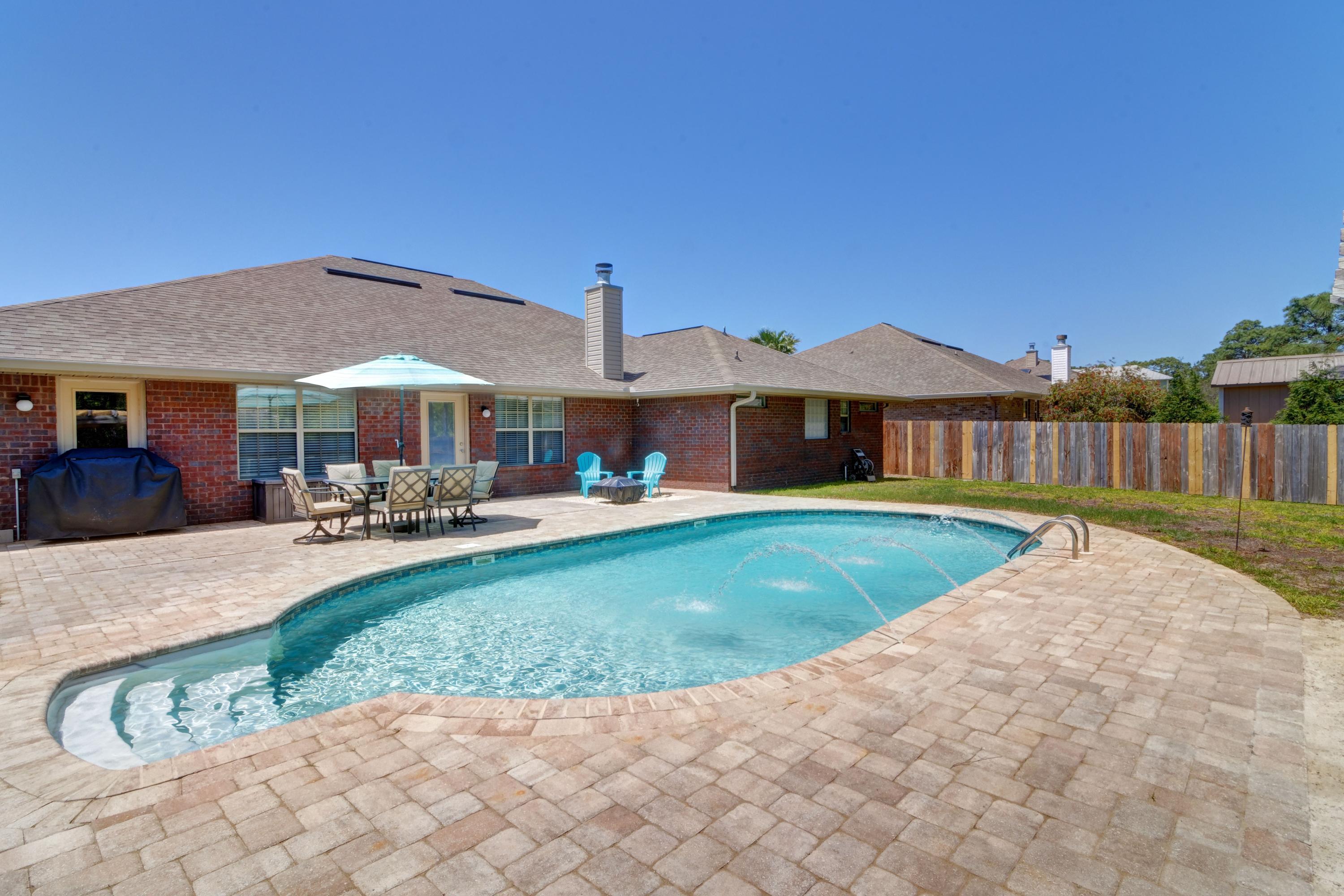 *POOL HOME* Welcome home to this stunning 4 bedroom/3 bathroom all brick beauty located in the popular and beautifully maintained neighborhood of Summerset Estates. Featuring over 3,000 sq ft of living space with a stunning backyard oasis complete with a salt water pool, custom pavers, a pergola covered sandy beach area, and firepit space all within a privacy fenced backyard (and no neighbors behind you!) this is the paradise you've been waiting for! Pull up the front driveway and appreciate the tasteful landscaping and lovely palms, and walk up to the custom glass front door where you'll enter inside and take in the oversized family room with cathedral ceiling as well as the beautiful stacked stone fireplace with a raised hearth and mantle. Looking for a large kitchen? You've come to the right place! You will love the spacious kitchen with plenty of cabinet space adorned with granite counters and newer stainless appliances, and a separate eat in kitchen space. The huge walk in pantry has all the space you need, and the laundry room features a door to the outside where you can throw all those wet clothes from the pool! The massive master suite has a custom trey ceiling, double granite vanities, two walk-in closets, a garden tub, and a 4ft separate shower with seat. The other three bedrooms are great sized two two more full bathrooms. Be sure to check out the list of seller updates, and have peace of mind with Dalton Fabric Shield Hurricane protection. Don't miss out on the best of Florida living in this stunning and spacious home!