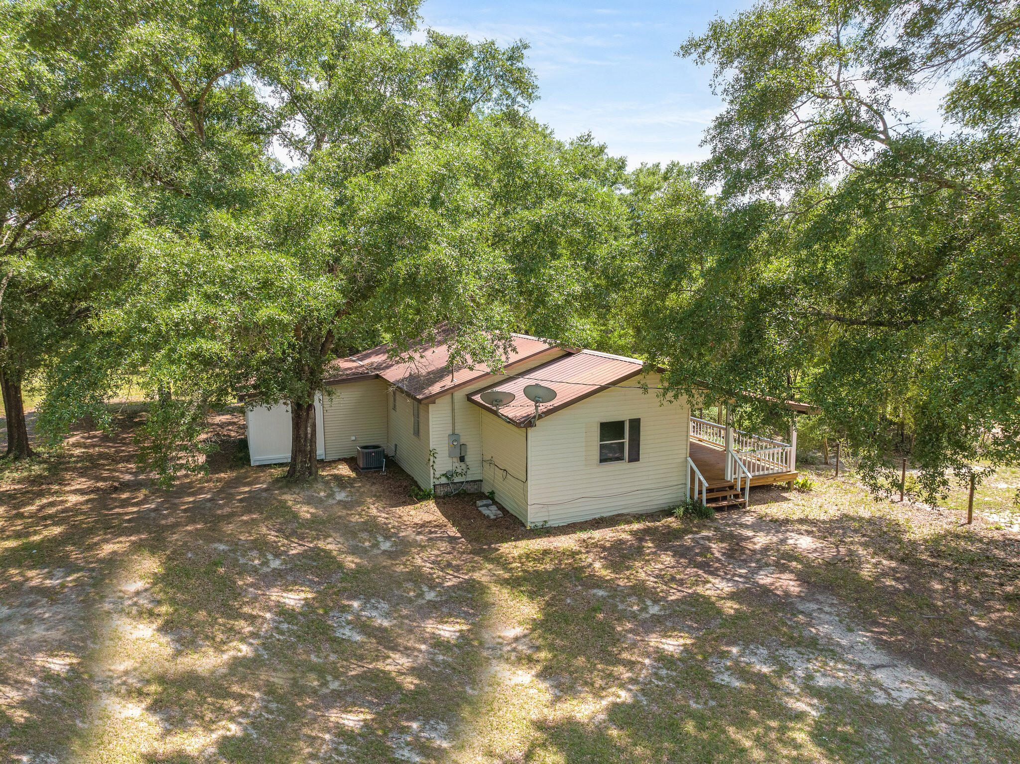 Looking for country living at its finest while close enough to everything? Then check out this renovated 4 bedroom and 2 bathroom property sitting on 1.31 acres of pure country awesomeness. House has brand new paint all throughout with all new light fixtures and ceiling fans everywhere. New Luxury Vinyl Plank flooring all throughout to match the country feel. Bathrooms boast porcelain tile flooring, new vanities and toilets. In the kitchen, enjoy the new granite countertops and stainless steel appliances.

Step outside into the huge porch to enjoy the fresh air or step inside the screened in section for a little more comfort. The lot is a dream come true for outdoor enthusiasts. With plenty of room for play, pets, ATV's, RV's, boats and gardening, there will never be a dull moment.