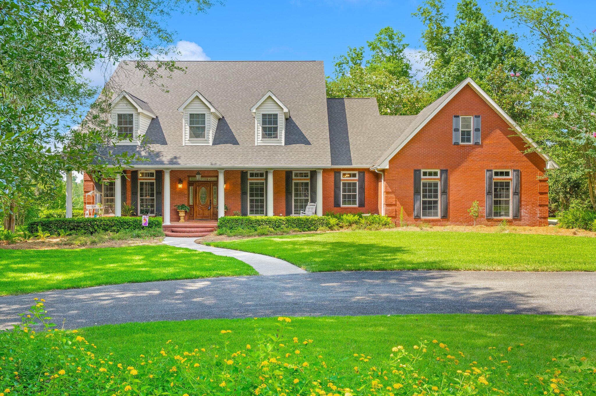 UNDER CONTRACT; SELLER ACCEPTING SHOWINGS AND BACKUP OFFERS
This custom one owner home, perfectly situated, on arguably the most beautiful, private 4 acres. At the bottom of the property you'll enjoy the waterfront living off of your private dock on Merritt's Mill Pond. Step inside this 5 Bedrooms, 3.5 Bath home with Office, to discover a beautifully designed interior with features such as coffered ceilings, crown molding, and built-in bookcases. The kitchen is a chef's delight with a kitchen island, pantry, double oven, gas cooktop, and stainless steel appliances. Enjoy the convenience of a First floor spacious primary bedroom. It boasts a luxurious en-suite bathroom and ample closet space. The private split floor plan allows the additional 4 bedrooms to be upsta productivity. Or study time in the Home Office.  Outside, a spacious porch for outdoor entertaining, even a gas hook up for your grill. Looking out you'll see rolling green grass, and down below you'll find a dock for enjoying the water.The property also includes a 2-car attached garage and lots of additional driveway parking. Don't miss out on this incredible opportunity to own a waterfront oasis in Marianna. Schedule your private showing today