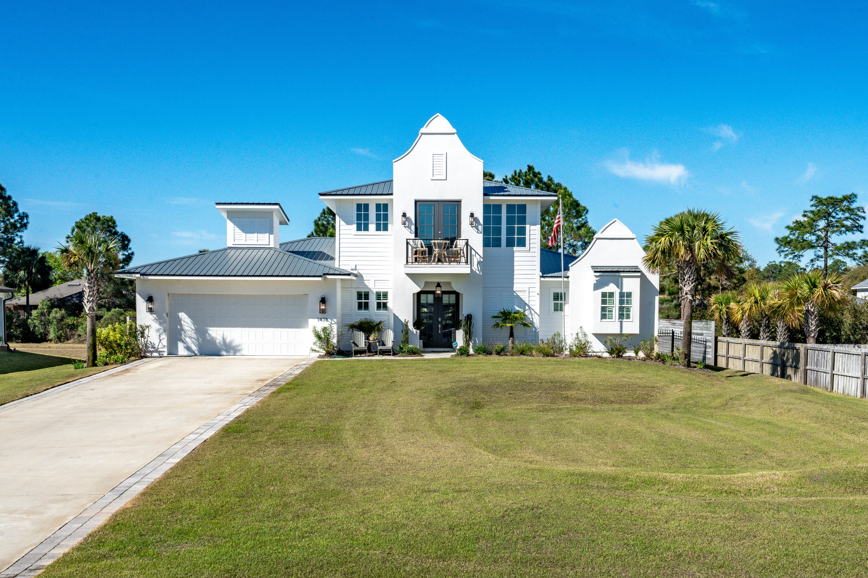 Casual elegance best describes this 2022 custom build located on over 1/2 acre with in-ground pool, stunning Bay views, and NO HOA. The owners used their expertise when building the home and added architectural improvements and design features which set this showplace apart from the rest. 

Envision a day in your beautiful home. Rise in the morning in the first-floor master bedroom bathed in natural sunlight looking out at the sparkling pool through the French doors. Cozy up on a brisk January afternoon by the gas fireplace in the great room. Relax on the second level Juliette balcony in the early evening with your beverage of choice while gazing out to the tranquil waters.

The gleaming kitchen island is the perfect gathering spot for conversation while whipping up culinary delights. The easy flow continues to the outdoor covered living area with built-in kitchen which includes a gas grill, ice maker and mini fridge. Patio sunshades will help keep the pool at a delightful temperature during the summer months, which is also heated for year-round enjoyment.

Additional notable features include a coffee bar in the mudroom accessible to the kitchen through the glass paned door, finished storage areas, upgraded tile/cabinetry/fixtures and electric elements, a glass shower door in the master bath, a coffered master bedroom ceiling, closet shelving, loft built in bar with mini fridge, termite baiting system, overhead garage storage system, lush tropical foliage and landscaping, and a fully fenced backyard with plenty of room for play and furry family members. There is also room to build a pool house if so desired. Full list of notable features, architectural changes from the original design, and improvements available.

Community amenities include a waterside park complete with playground, walking path, multi-purpose fields, basketball court, pavilions, bbq grilling areas, pickleball, pond with fountain and green space with parking and restrooms.

Local points of interest:
Driftwood Estates Park 0.6 miles
Sacred Heart Hospital 3.7 miles
Grand Boulevard 4.7 miles
Topsail Hill Preserve State Park 5.7 miles
Silver Sands Premium Outlets 6.6 miles
Cessna Landing Boat Launch 9.9 miles

Whether you are wanting to purchase a full-time residence or second home on the Emerald Coast, this gorgeous property will impress the most discriminating buyer desiring the Florida lifestyle. 

Washer and Dryer and Master Bedroom Curtains and Hardware do not convey. Some master bedroom and master bathroom fixtures have been changed out and replaced since photos were taken. All information is believed to be accurate. Buyer to verify pertinent information.