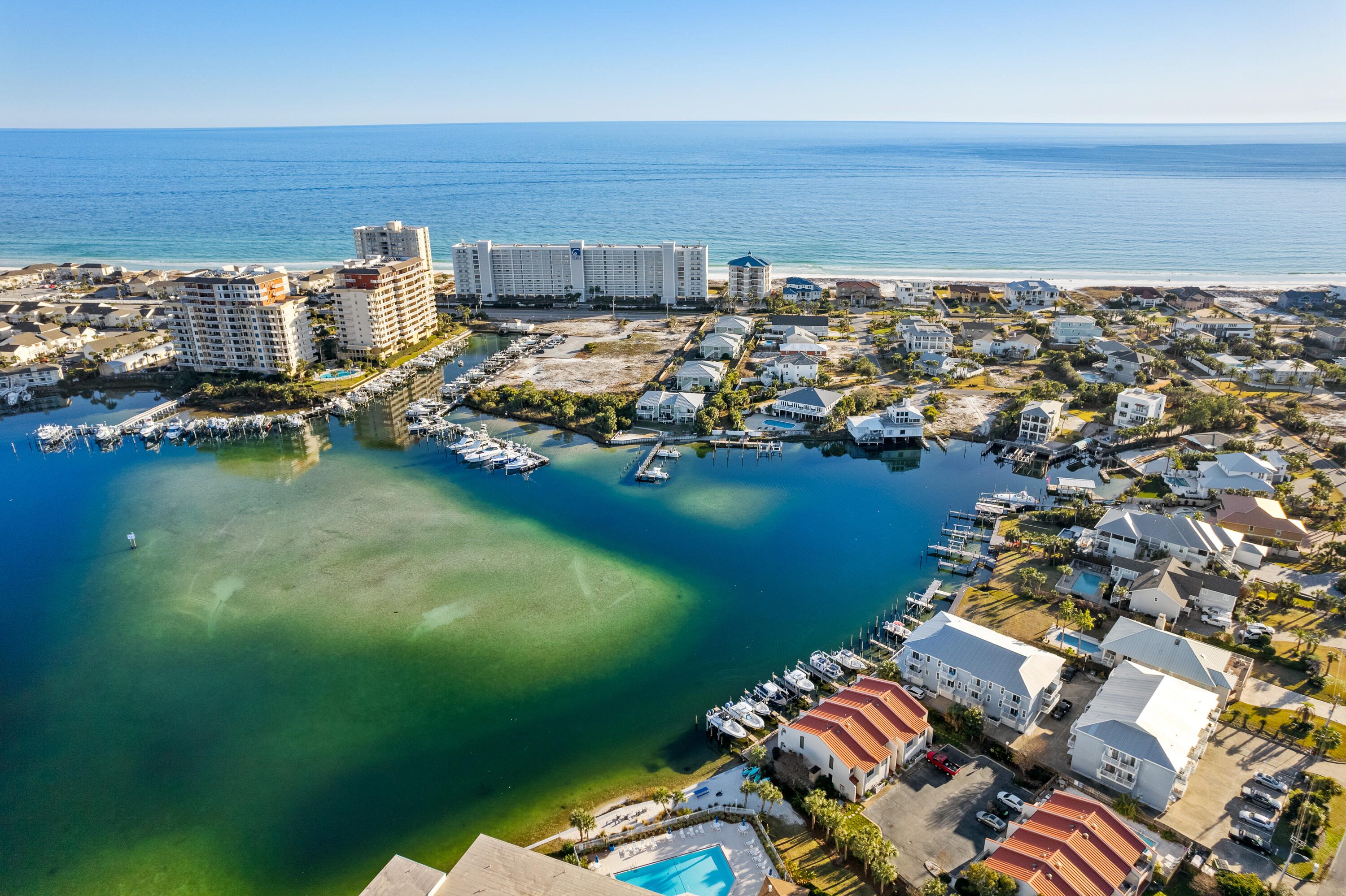Attention all boat and beach lovers, you have found paradise and your waterfront oasis in the heart of Destin, Florida! Unit 6 at Laguna Point Condo is a recently renovated 2bedroom/2bathroom condo that's turnkey ready as a beautiful primary home or vacation rental machine! First floor features a large garage with plenty of storage for water toys or a golf cart plus 1 assigned parking space!  You will love the new luxury vinyl wood plank flooring throughout plus new paint, furniture and more!  The kitchen boasts coastal elegance with the white quartz counters, new cabinets, subway tile backsplash and new stainless appliances!  Bedrooms are located on the top floor with their own private baths!  Take note of the extra custom features such as built-in bunks, new counters, cabinets and stylish penny round tile floor!  
Laguna Point Condos is a low density complex with only 16 units!  HOA owned dock space and boat slips on the harbor and only a block away from gated/deeded access to the pristine white sand beaches of the Emerald Coast. Have the best of both worlds living on Holiday Isle!  Only a 5-minute walk to the beach plus you're within walking/golf cart ride to many restaurants, retail and nightlife or jump on your boat and be minutes to the Gulf of Mexico!  Start living the dream today! 
HVAC new in May 2025**