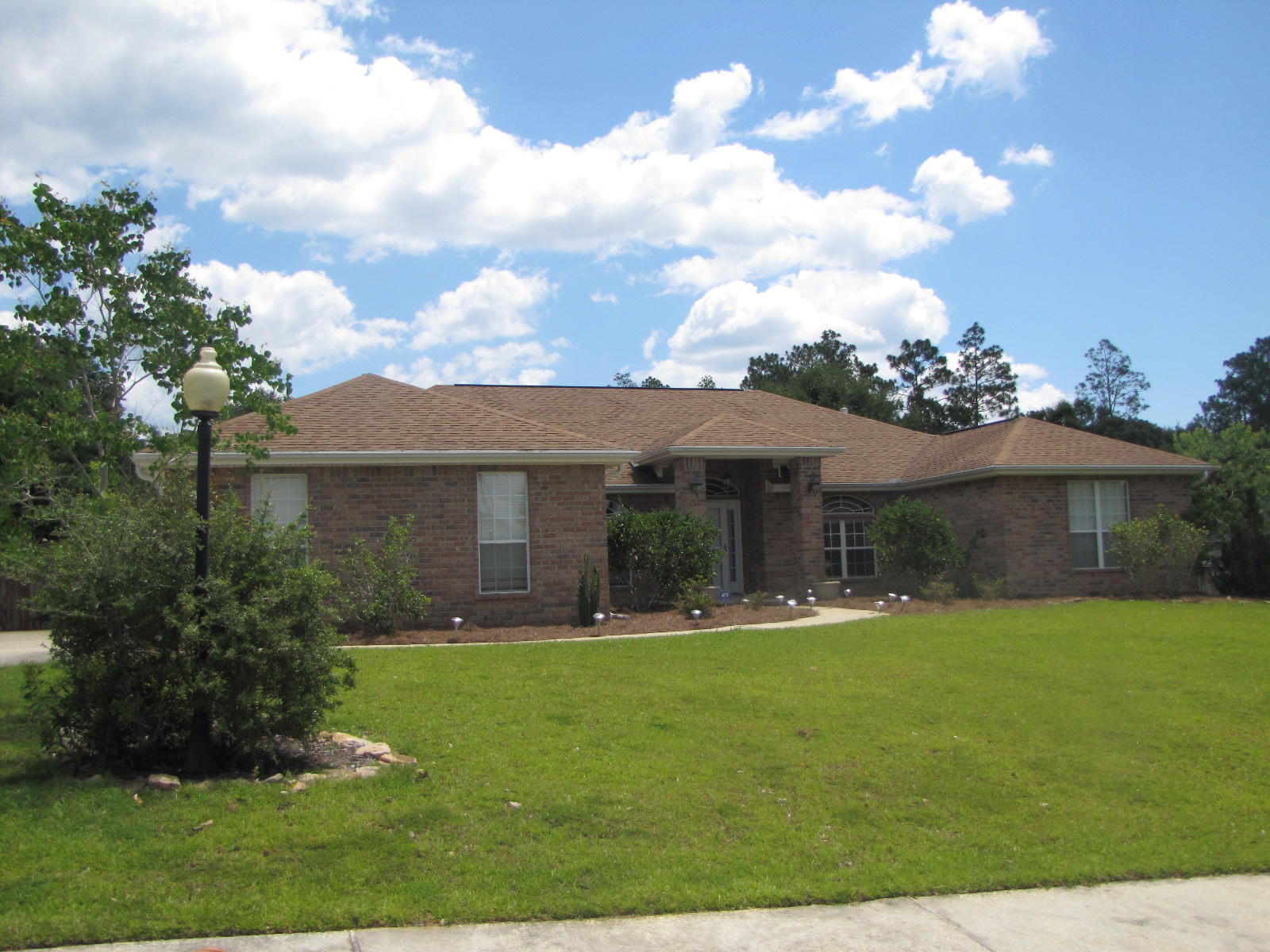This home is located in a nice subdivision with a community pool. The kitchen features plenty of counter and cabinet space, built in desk area, pantry, breakfast bar, breakfast area, and all appliances including the refrigerator. In addition to the 4 bedrooms the home has a formal dining room and a formal living room with French doors for added privacy. The master bath has double vanity, separate shower, jetted tub, and walk in closets. The yard is privacy fenced and owners will allow a dog with breed approval and pet fee. This rental is available for move in June 15, 2016