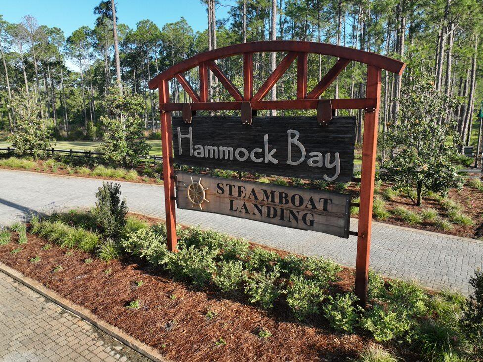 BUILD YOUR  DREAM HOME IN THE STUNNING WATERFRONT COMMUNITY OF STEAMBOAT LANDING! One of only 5 remaining Lots in Steamboat Landing. Craft Your Slice of Paradise on this Exquisite Wooded Lot. Take leisurely strolls along the boardwalk leading to the fully-built Bayfront clubhouse, now open and available for all residents to enjoy. Savor breathtaking sunsets and bask in the beauty of Choctawhatchee Bay from the 500 ft dock—an experience that's right at your doorstep.