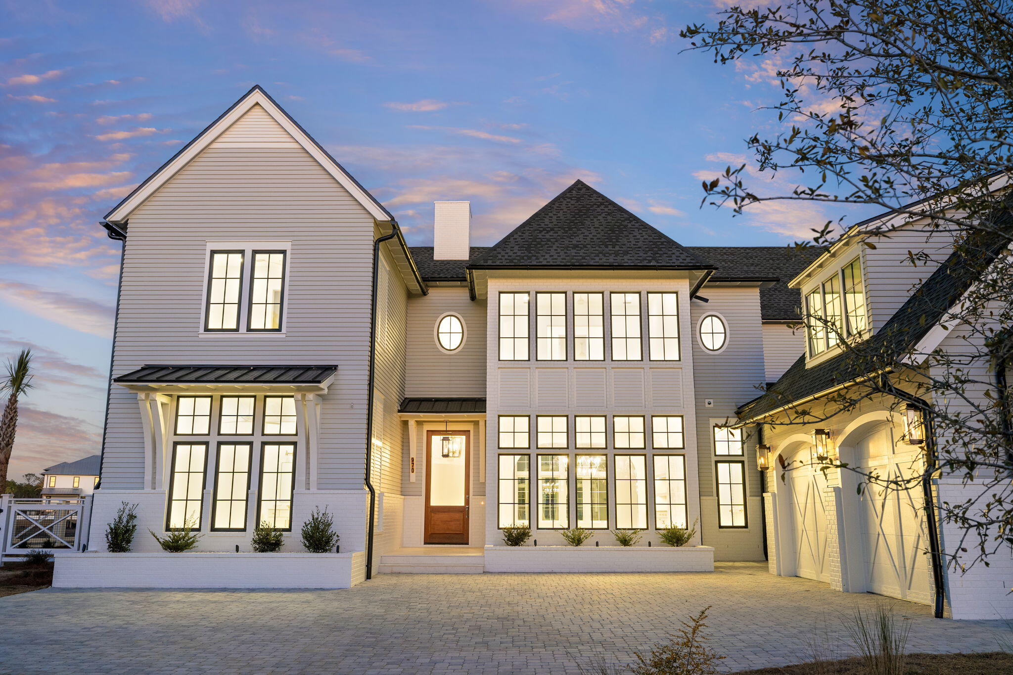 Tucked inside Watersound Camp Creek, this newly constructed estate deliver 6,343 square feet of refined coastal living. With six bedrooms, seven full baths, and two half baths, the layout is expansive yet intentional, designed for both privacy and effortless entertaining.

Soaring ceilings and natural light define the interiors. Venetian plaster walls, clean architectural lines, and carefully selected finishes create a timeless aesthetic. The kitchen is finished with custom cabinetry, professional grade appliances, Taj Mahal quartzite countertops, and hand made Moroccan tile that adds depth and texture. A separate scullery keeps preparation and storage discreet, while a well designed mud room adds everyday functionality without sacrificing design. Two full laundry rooms, one on each level, further support long term livability for owners and guests.

The home enjoys golf course views from the front, creating an open and distinguished arrival, while the backyard backs to a large pond, offering privacy and a peaceful water backdrop. The covered lanai, fully equipped outdoor kitchen, resort style pool and spa, fireplace, and mature Sylvester palms create a true extension of the living space.

The two and a half car garage provides ample space for vehicles, golf carts, and beach gear.

Ownership includes access to the Watersound Club, one of the most comprehensive private club experiences along 30A. Amenities include a 6,500 square foot zero entry pool, a 270 foot lazy river, wellness center, eight Har Tru clay tennis courts, eight pickleball courts, a dedicated adult pool, and multiple dining venues. Golf access includes Camp Creek Golf Course designed by Tom Fazio, along with Sharks Tooth and The Third. The Watersound Beach Club offers over a mile of private beach frontage with full service chair and umbrella setup and coastal dining.

Positioned just off Scenic Highway 30A, the home offers privacy while remaining minutes from dining, boutique retail, scenic trails, and championship golf.

This is a thoughtfully executed coastal estate inside one of the most desirable club communities on the Emerald Coast.