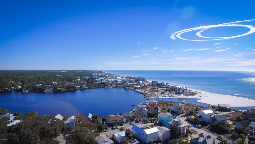 Calling all 30A enthusiasts. Mobile home on 2 buildable lots in an awesome location, south of 30A. These lots have many wonderful features. Besides being south of 30A, they are only a few blocks to both the beach and Eastern Lake! Located in Old Seagrove Beach, in the quaint Dalton Community (which has lots of live oak trees and a nostalgic feel). The public boardwalk is only about 2 blocks away as is Eastern lake. This sweet area has a comfy feel. These lots are in a perfect area to build your beach home or a vacation rental. The mobile home is a 3 bedroom, 1.5 bath with an inviting screened in porch. Currently being used as a beach get a way, which you can too until you are ready to build. They are truly beautiful lots come and see!