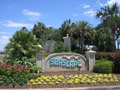 Calling all investors!  This unit is priced to renovate.  Enjoy this second floor condo in a gorgeous 300+ acre gated Seascape resort community. The unit features an open-plan living & dining area, large covered porch and peaceful green golf course views. Nestled in the Pine Trees at the end of a cul-de-sac with an expansive golf course view, within the gated Seascape resort is a delightful second floor unit perfect as a primary home, beach getaway or as an investment property and only a few blocks from the beach! Perfect for making memories this well-appointed condo is ready for you, your family and friends.