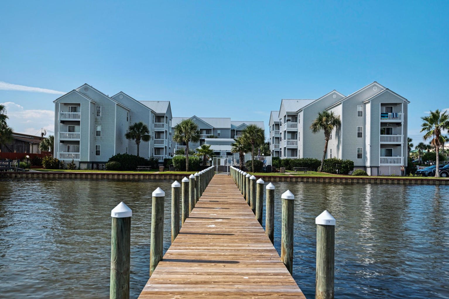 Photos coming soon! By far the best waterfront value in Destin/Okaloosa Island! These units are rarely for sale as many of the original owners from 30+ years ago are still hanging onto them. And GROUND FLOOR units (like this one) are virtually never available. This two bed is completely furnished and is vacation rental, second home or full time occupant ready. Grill, paddle board, kayak and fish in the bay...which is right in your backyard! Relax in the huge pool right on the bay. Castnet for mullet (there are tons) from your own private seawall. Walk out on your own private dock to hook the bigger fish. Sit the community swing and watch dolphins cruise by. Use the community traps to catch crabs. Grill up some ribeyes at your picnic table right on the water.
  Take your boat (trailer parking and slips available) on easy five minute ride to Crab Island...and to the private islands of Santa Rosa Sound. (Don't own a boat or jet ski? Rent one from Fudpuckers next door.) Enjoy dinner at the Okaloosa Boardwalk (1/4 mile) or Destin Harbor (2 miles). Watch the weekly fireworks displays from the comfy of your back porch or dock. Walk to the Okaloosa Pier to snag Cobia, Tarpon and Snapper. Walk to Okaloosa Park and relax on the beach while watching the kiteboarders and windsurfers do their thing. Launch your boat at Marler Park (only a mile away). Crazy convenient to both Destin and Fort Walton. A new property manager was hired two years ago and the property is always immaculate. Reasonable HOA fees include insurance, cable, internet, trash, water, sewer, exterior maintenance, pool and landscape maintenance. This is a small lifestyle property where your neighbors become your lifelong friends...and it is priced below 200k in a fast rising market!