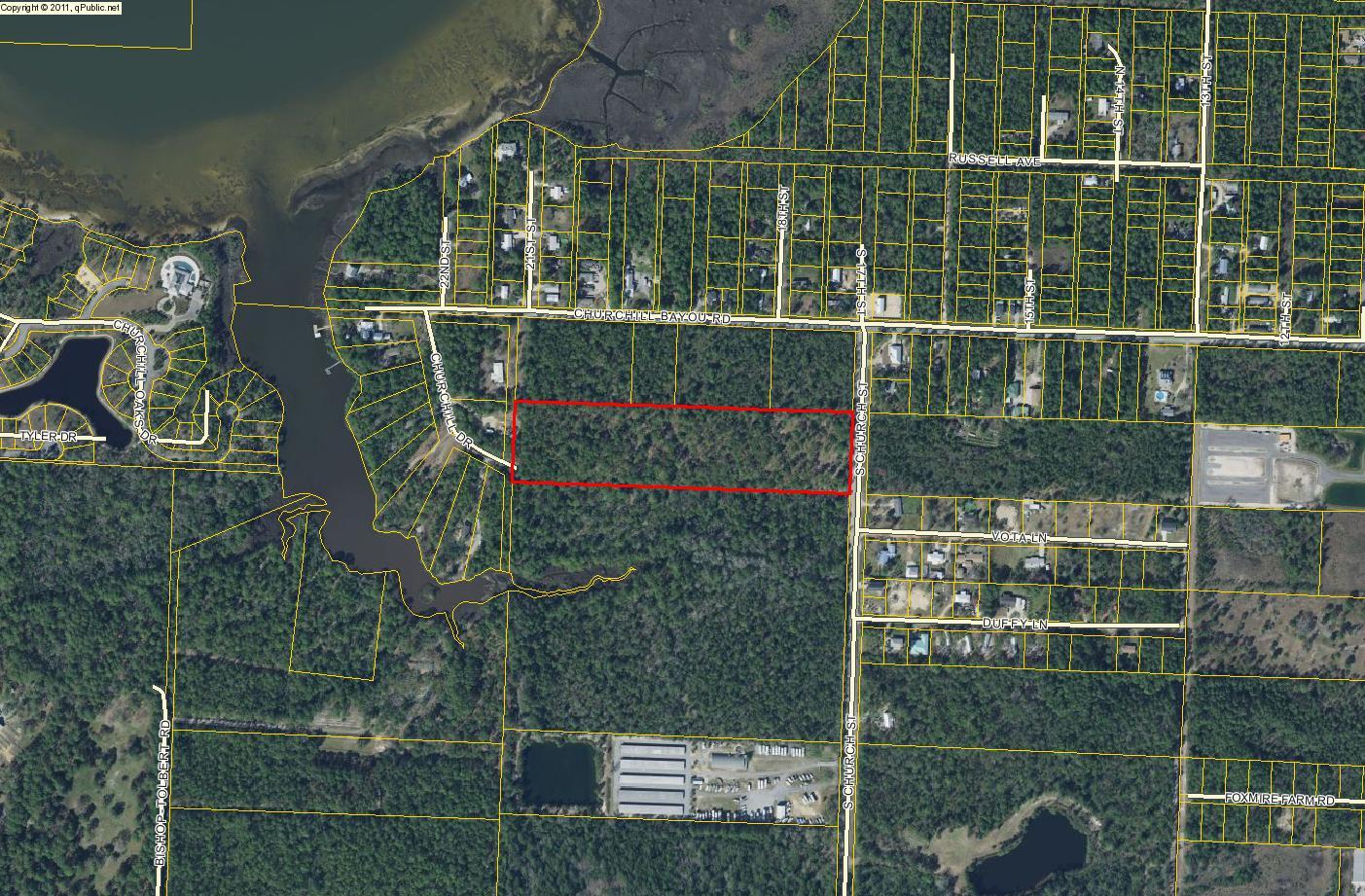 Approximately 10 wooded acres (partially cleared) of land on Church Street. Located not far from Hogtown Bayou and Cessna Park with picnic tables, basketball court, boat launch and the beautiful bay. Also near the beach, shopping and Sacred Heart Hospital. This parcel is zoned conservation residential (one home per 2.5 acres). The adjoining 40 acre parcel is owned by Trustees of the Internal Improvement Trust Fund/AG and Forestry & Game and Fresh Water Commission of Florida. Seller is a licensed Florida Realtor.