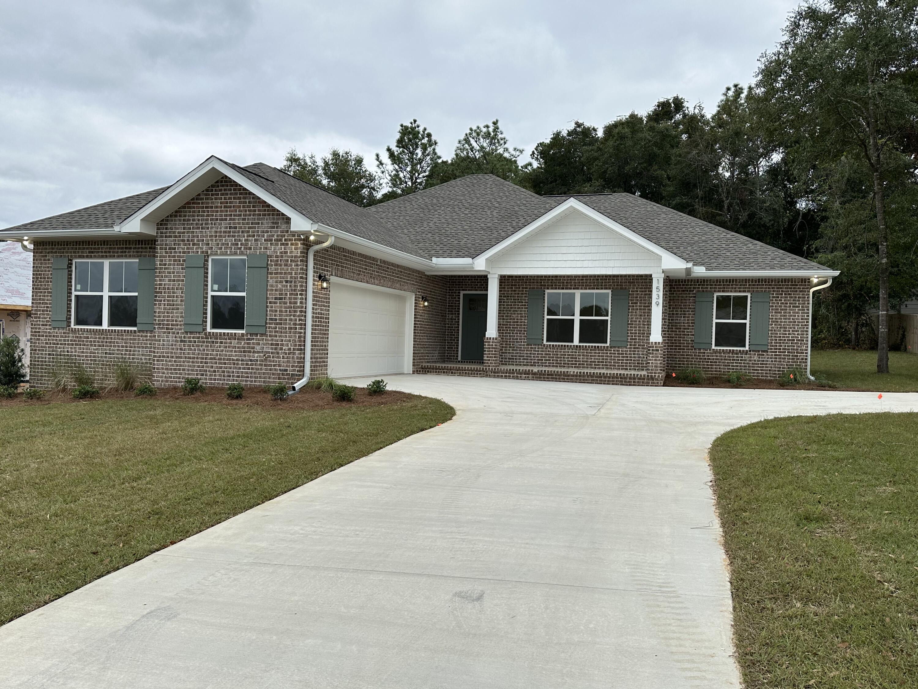 You still have time to choose some colors! This beautiful all brick home on a little over half an acre will be ready this fall- make this house your HOME! 4 bedrooms, 2 baths with a split floorplan. Dedicated dining area off of the kitchen and large living area to entertain. The master suite is large and spacious with the added amenity of a walk in closet that is 12x7 for plenty of storage. Master bathroom has a large tub and separate tiled shower, double vanities and water closet.  LVP flooring, granite or quartz countertops as well as special order cabinetry and tiled backsplash in the kitchen. Let the holiday's be at your home this year- plenty of space inside and out for your guests!